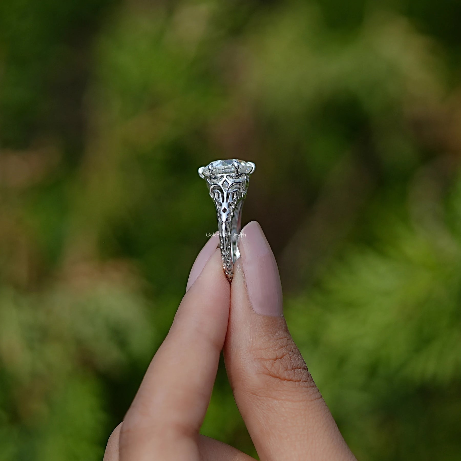 Side View of Moissanite Old European Cut Round Vintage Ring In two fingers