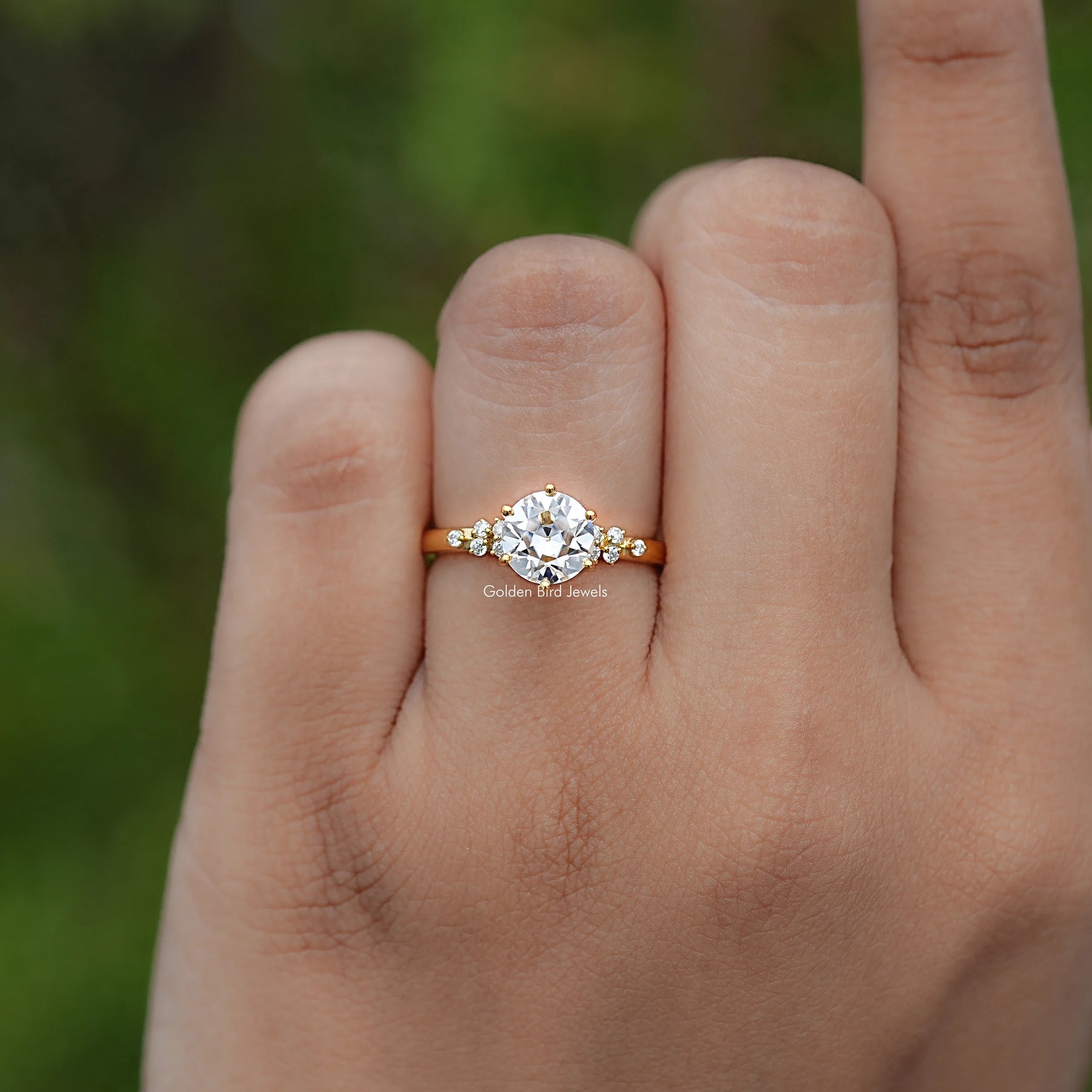 In finger view of Round Cut Moissanite Engagement Ring