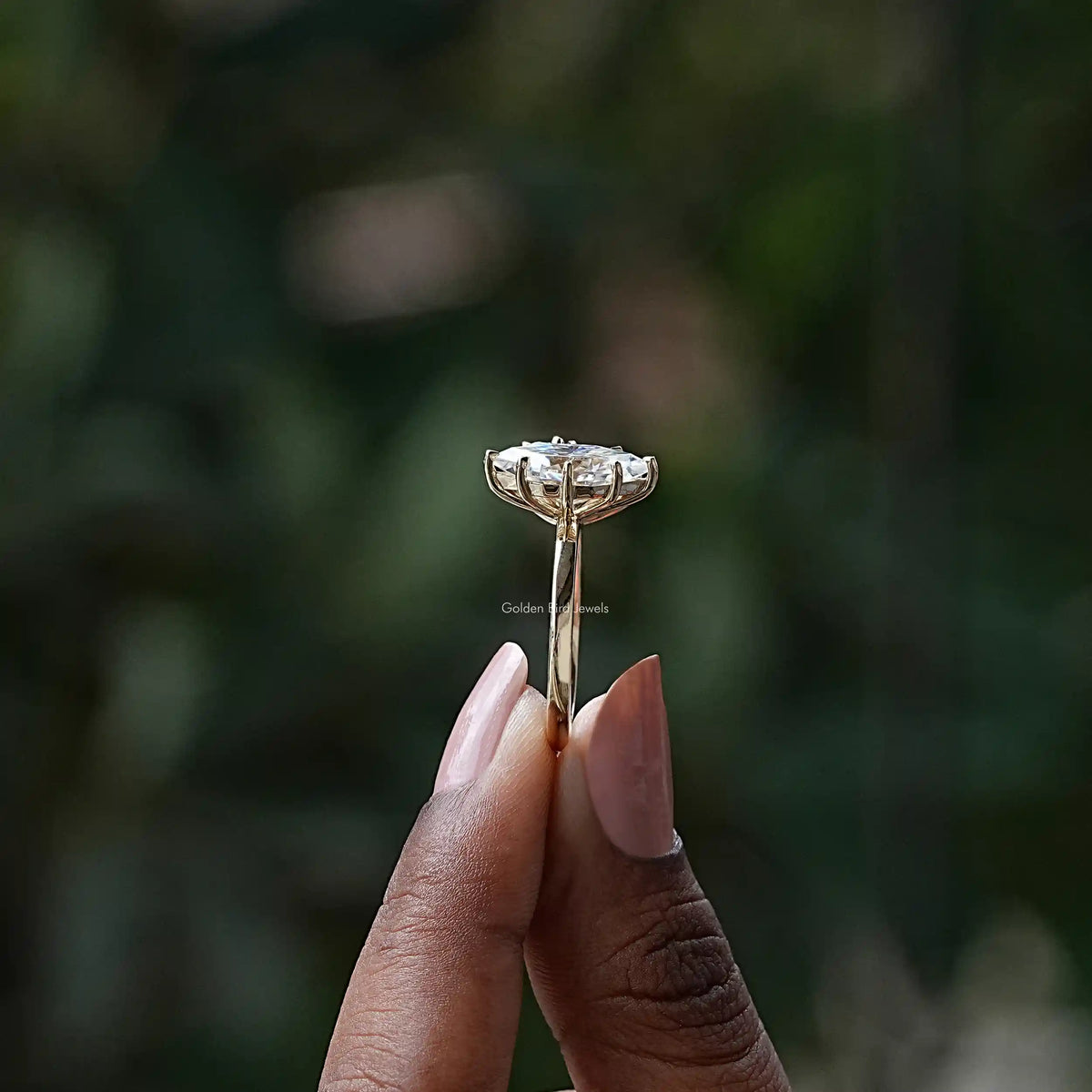 Side View of Pear And  Dutch Marquise Toi Et Moi Ring In two fingers