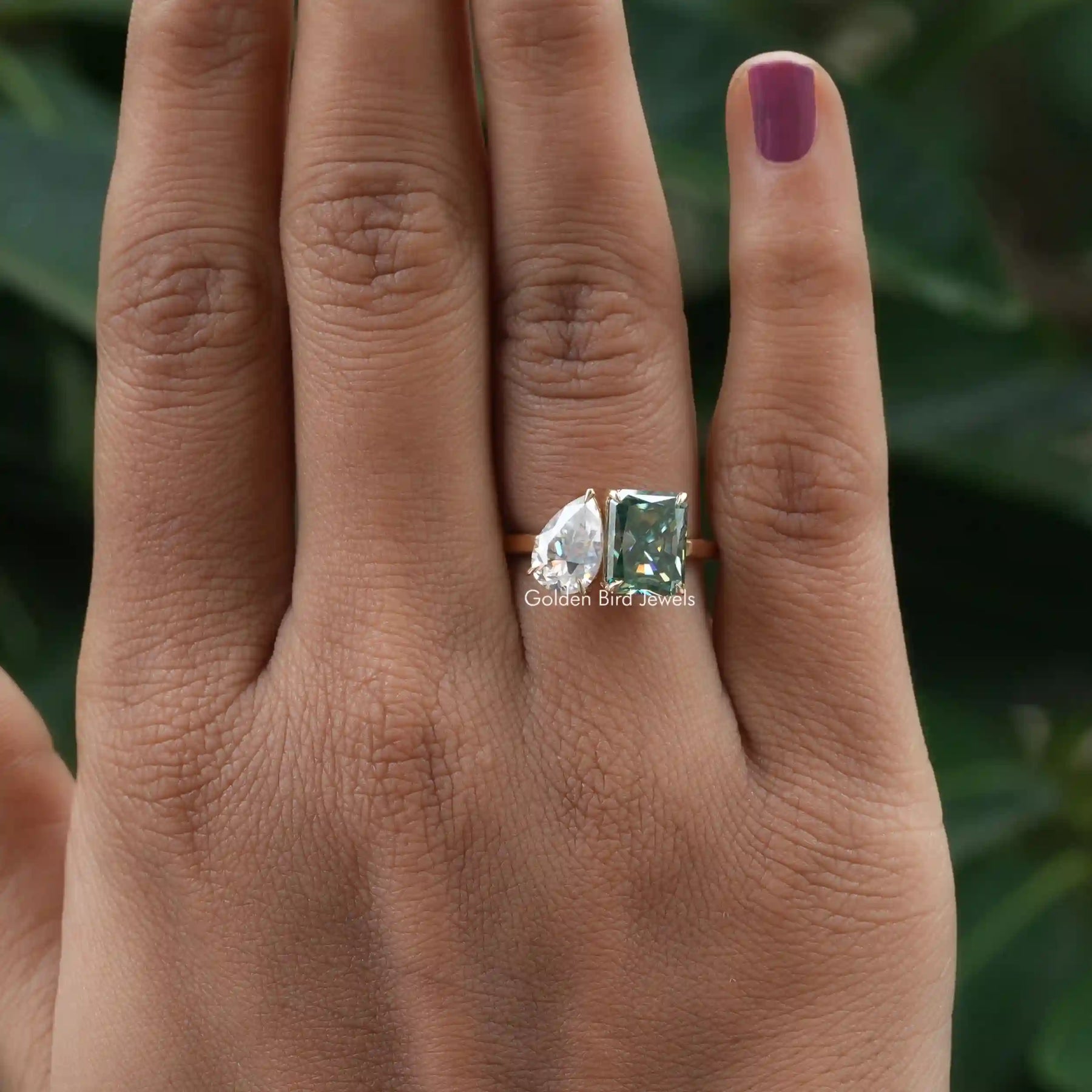 View of Moissanite Pear And Radiant Cut Toi Et Moi Ring In Finger