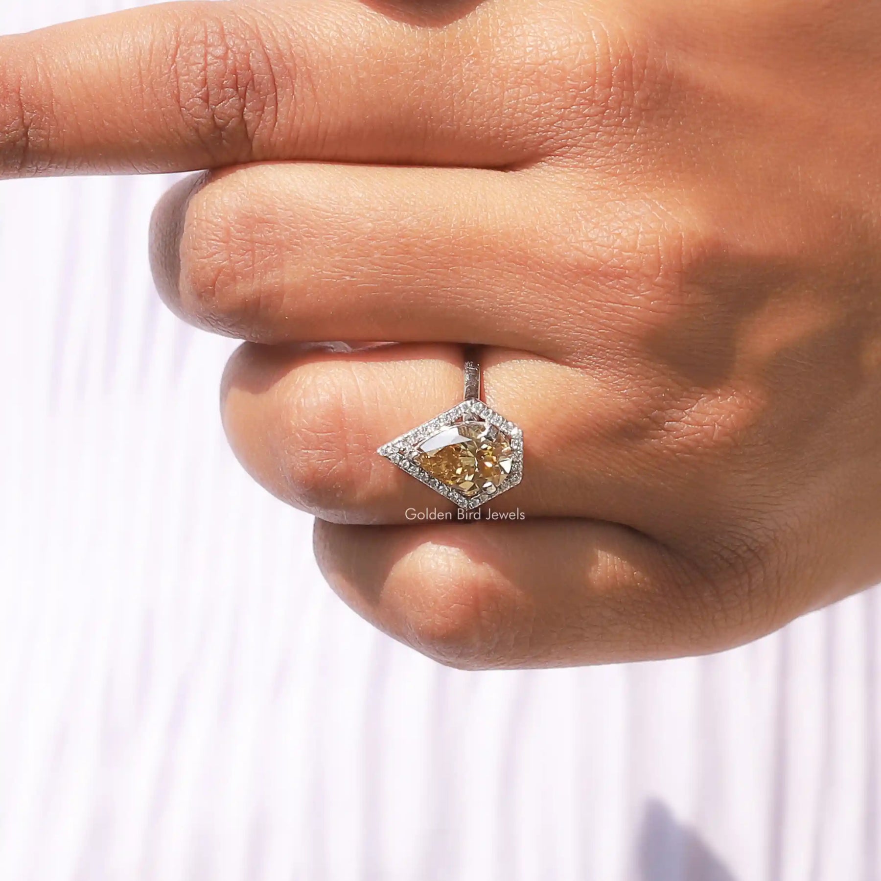 Pear Shaped Halo Moissanite Ring In finger