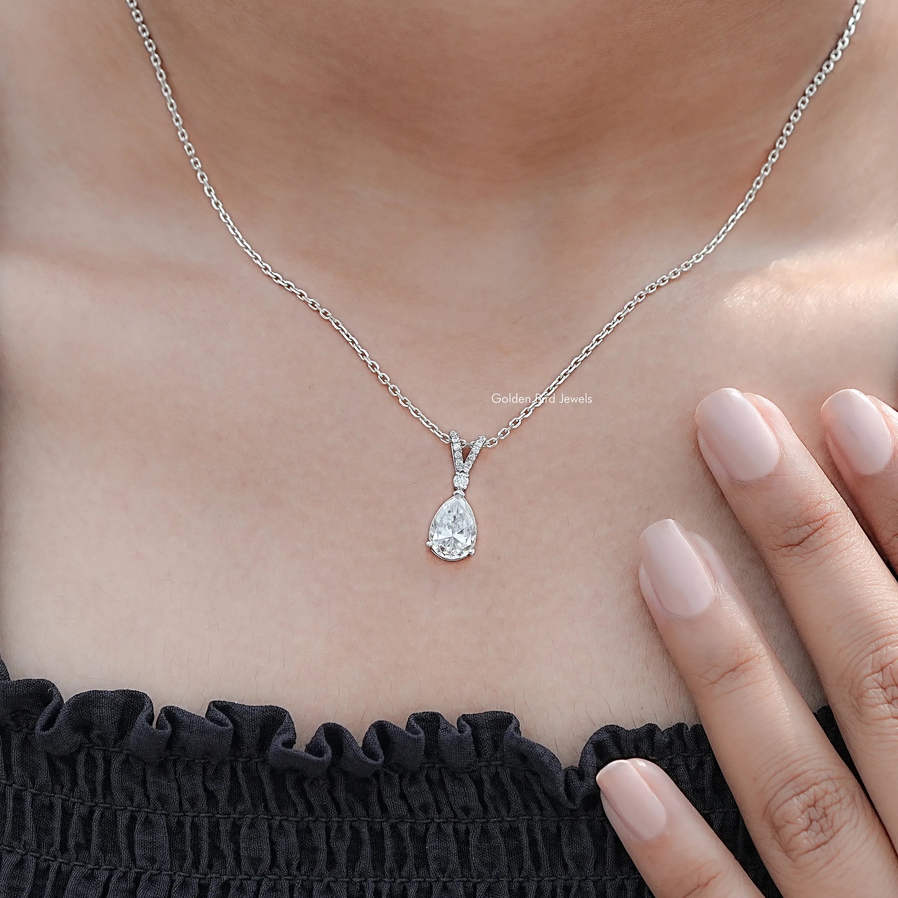 Side View Of Round And Pear Cut solitaire pendant