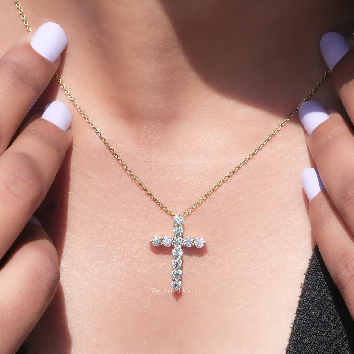 In neck view of round cross moissanite halo pendant