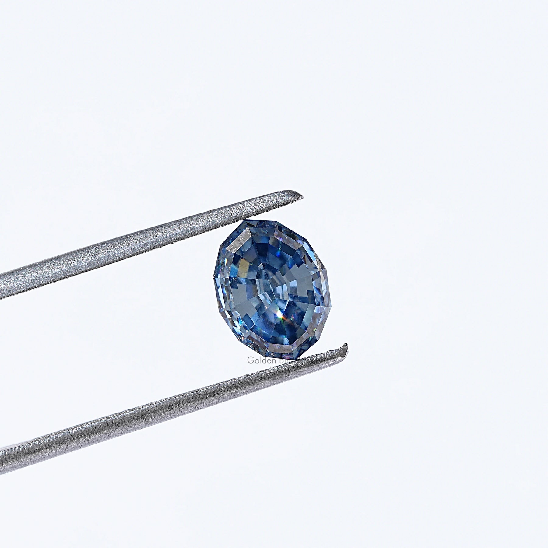 Twijer hold in the Moissanite Step Cut Oval Loose Stone In Blue Colour