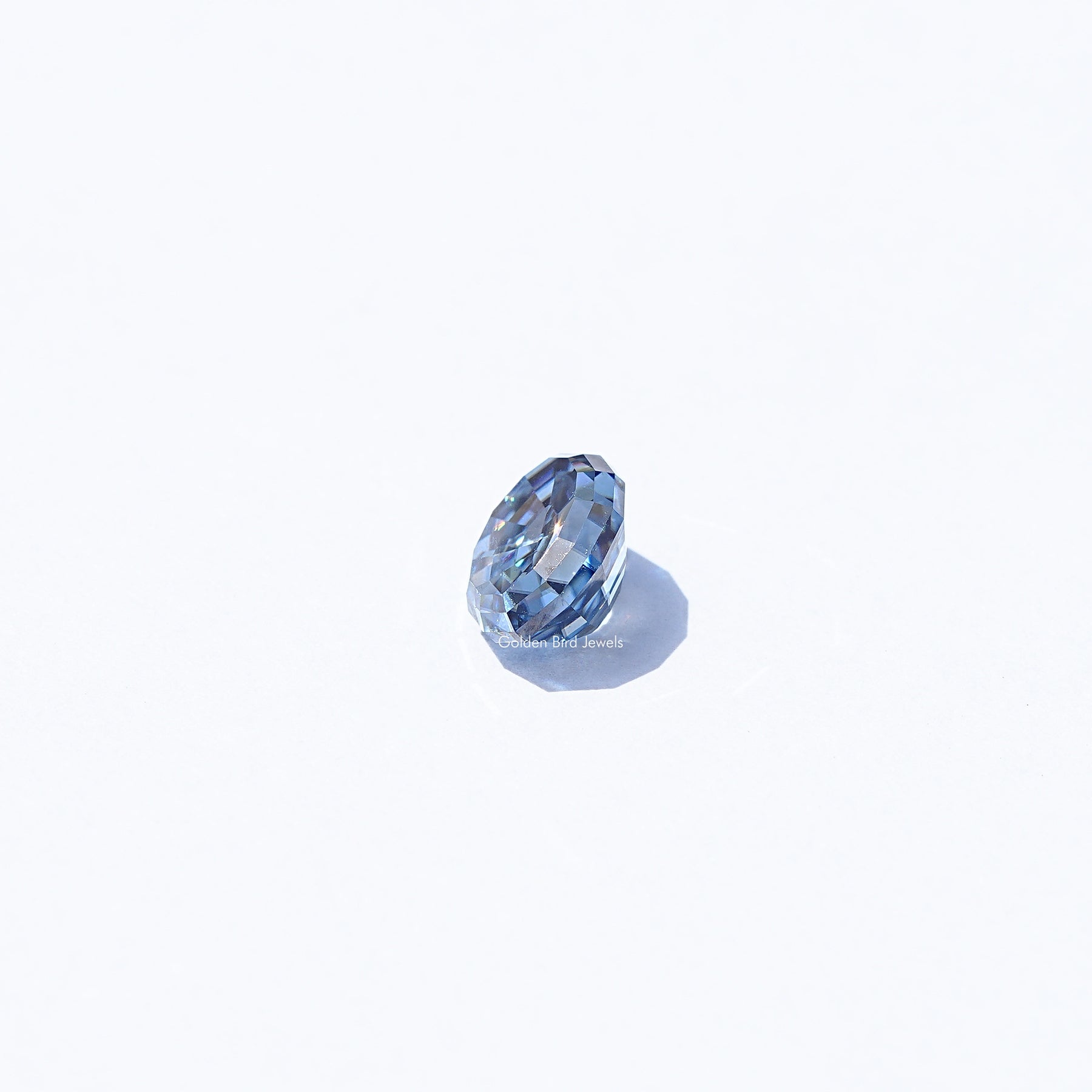 Side View of Oval Step Cut Moissanite Loose Stone In Blue Stone