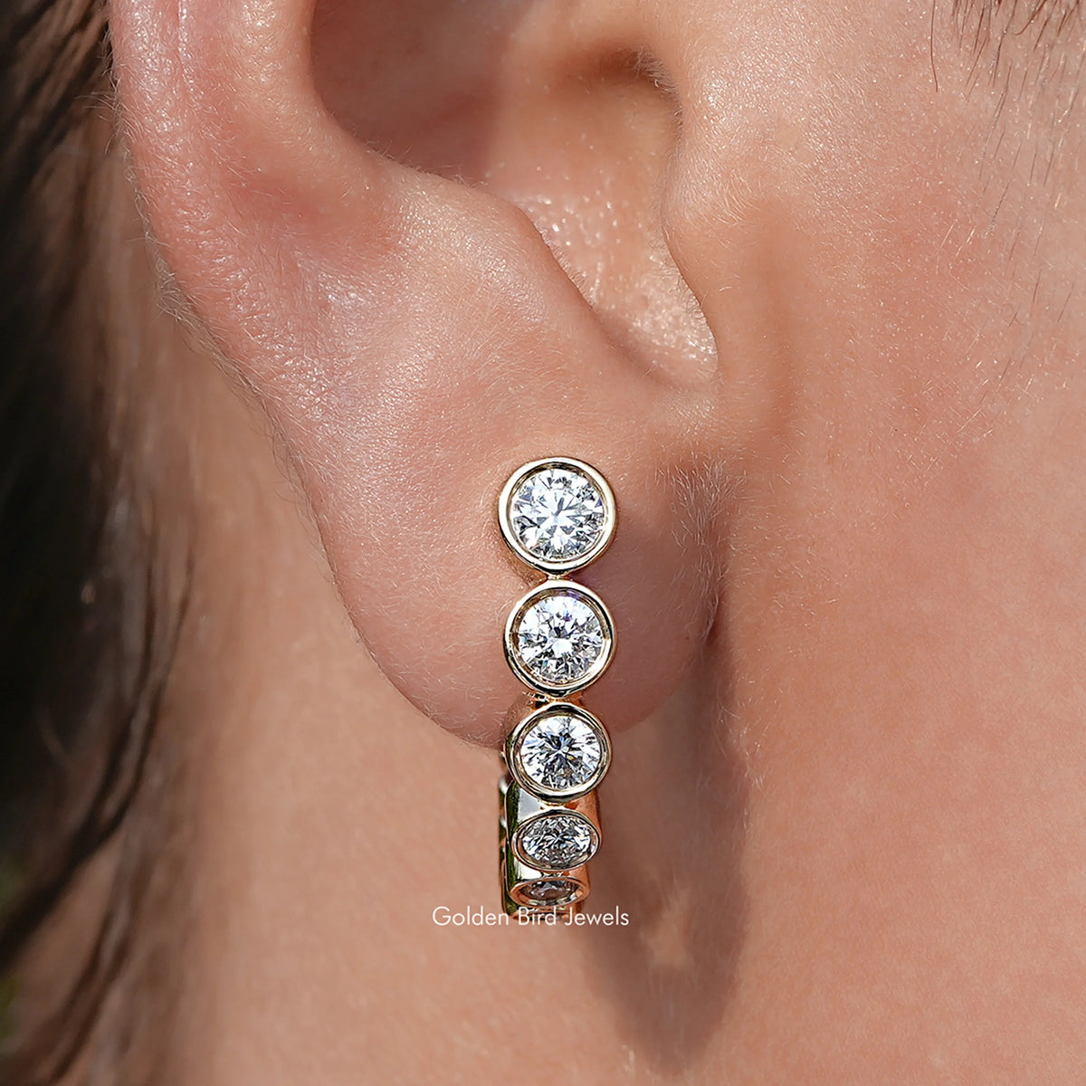 close up view of Round Graduated Lab Diamond C Hoop Earrings