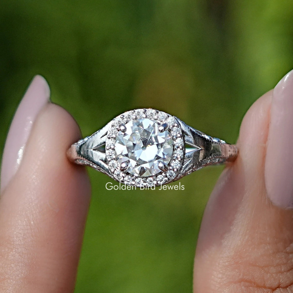 Front View of Old European Round Cut Moissanite Halo Ring In two Fingers