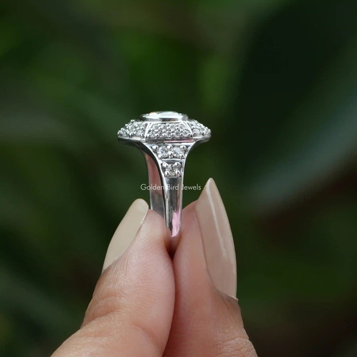 Side View of Old European Round Cut Moissanite Ring In two fingers