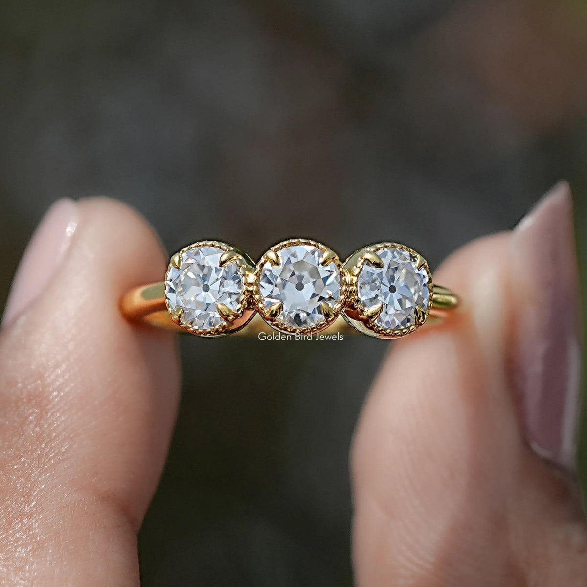 Front view of Old European Cut Round Moissanite Three Stone Ring