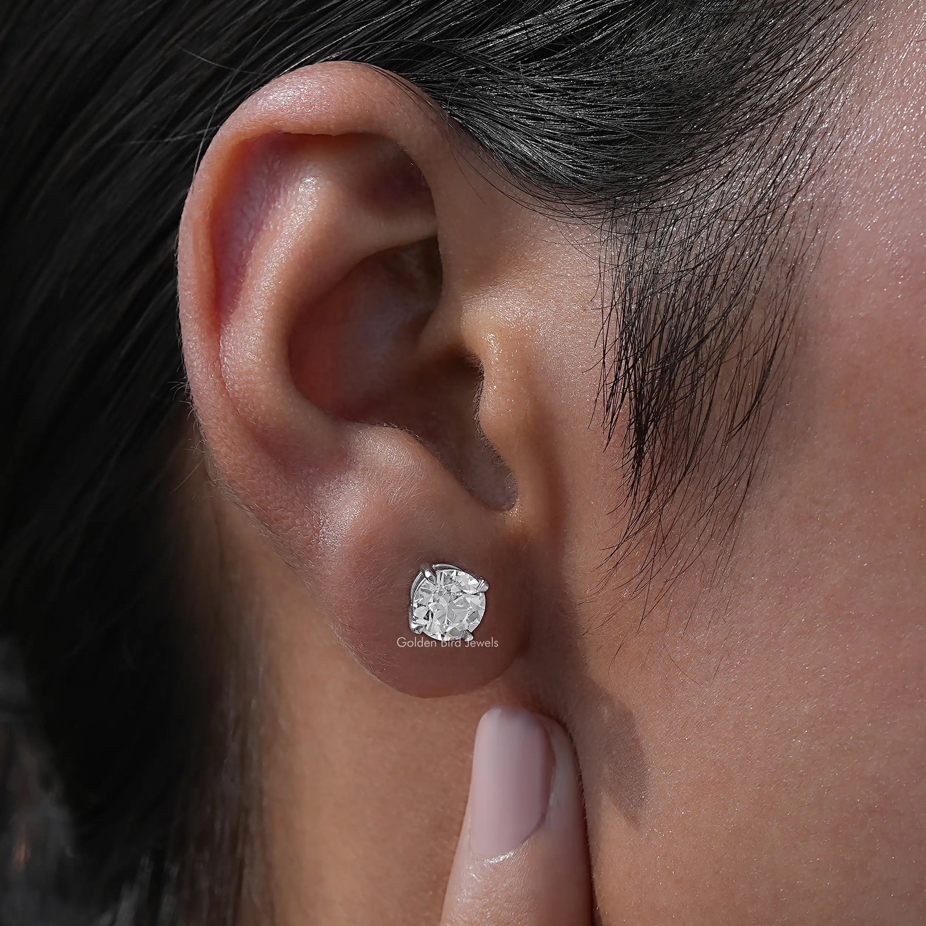 In-ear view of White Gold Old Europan Round Cut Studs