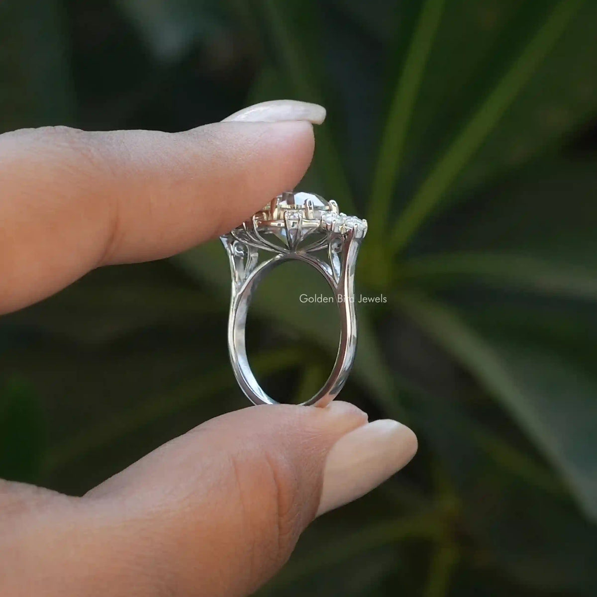 Back View of Old European Round Cut Moissanite Ring In two fingers