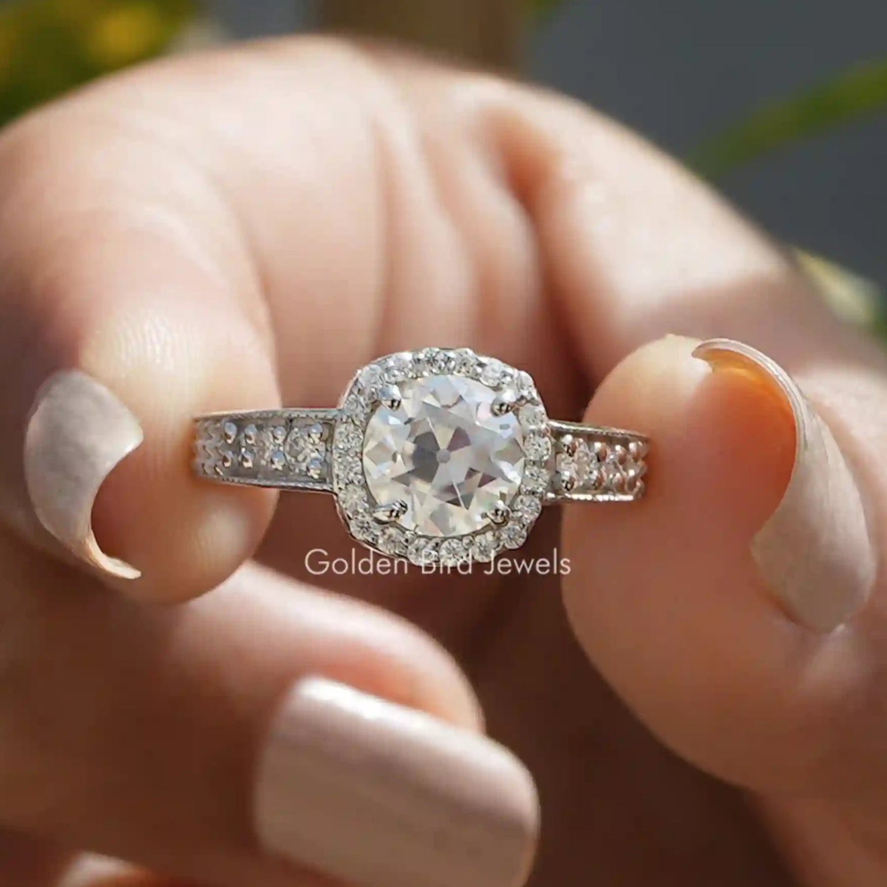 Front View of Old European Round Cut Halo Moissanite Vintage Ring In two Fingers