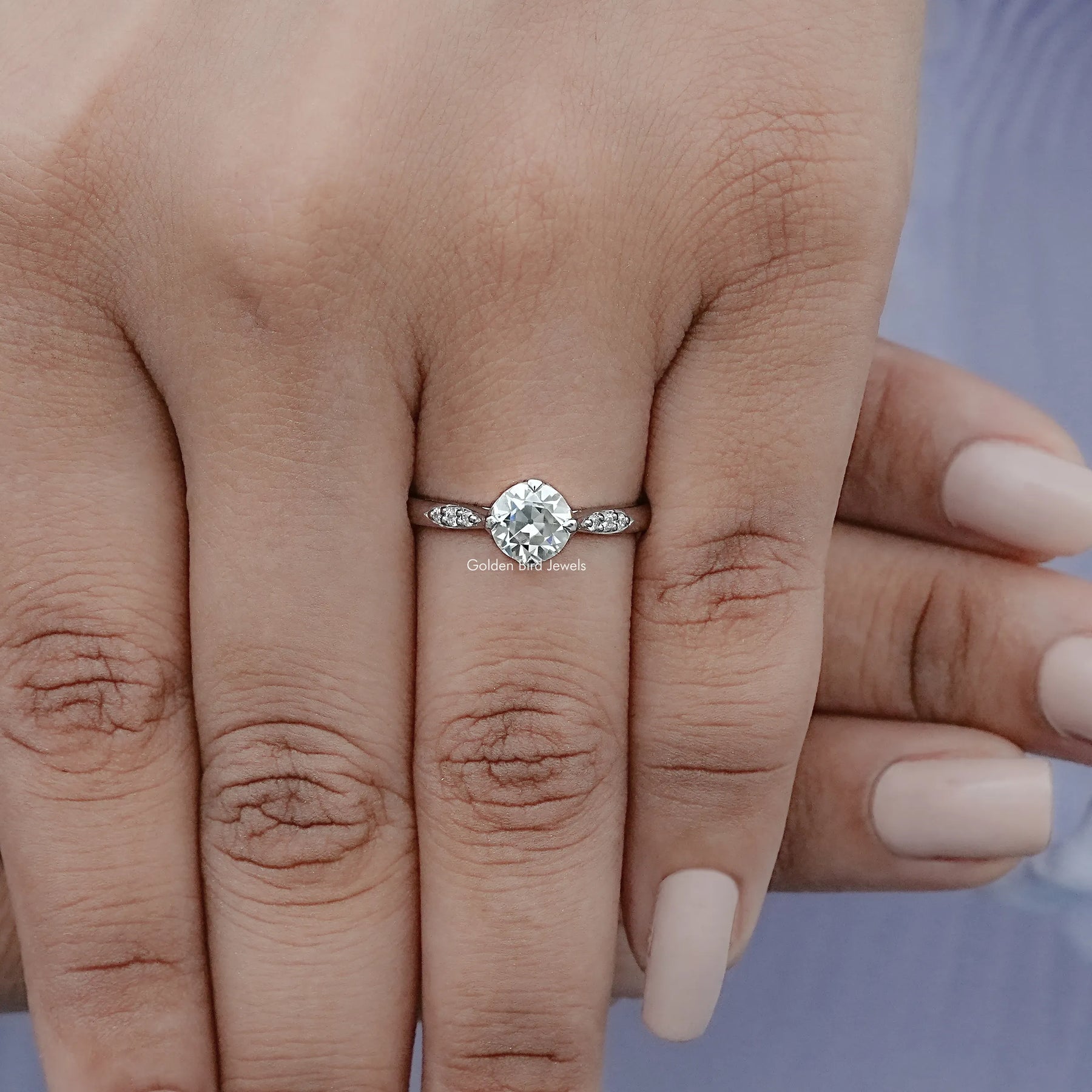 View of Round Cut Moissanite Engagement Ring in prongs setting