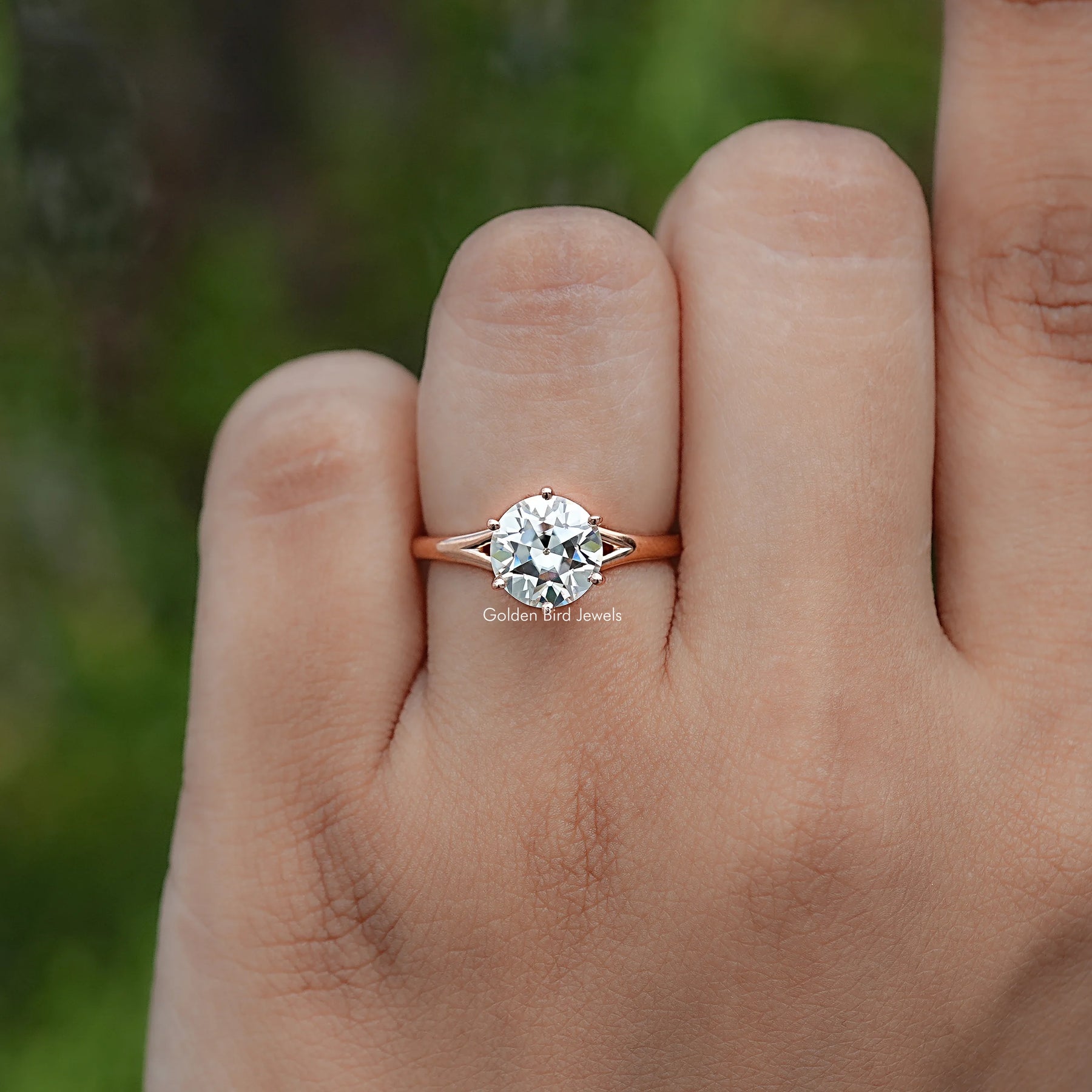 In finger view of Round Cut Moissanite Engagement Ring