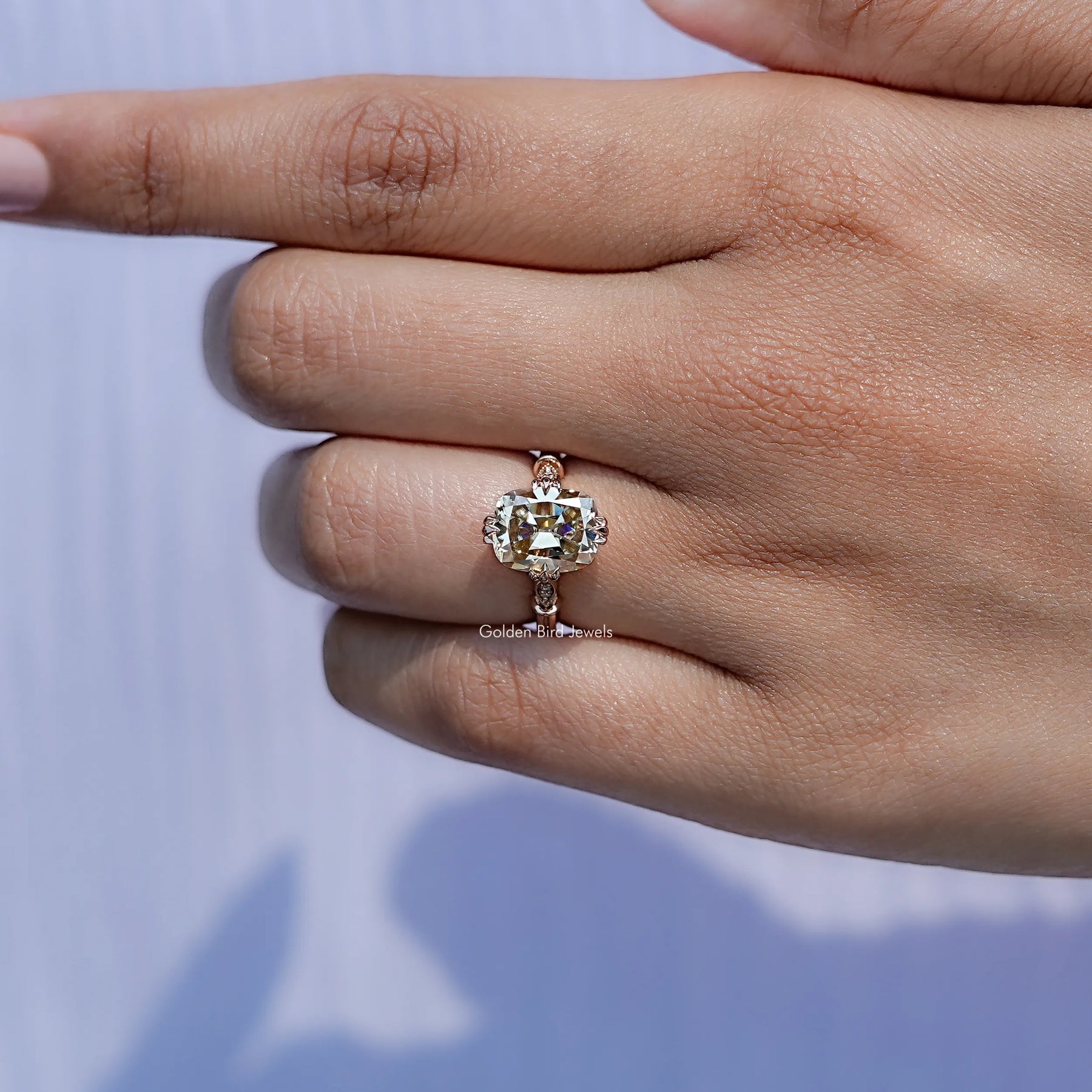 View of solitaire Cushion Cut Moissanite ring in prongs setting
