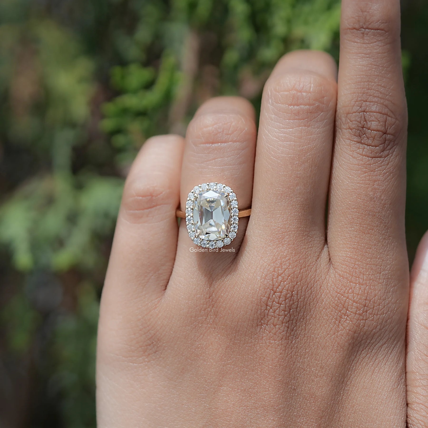 In finger view of Cushion Cut Moissanite Solitaire Ring