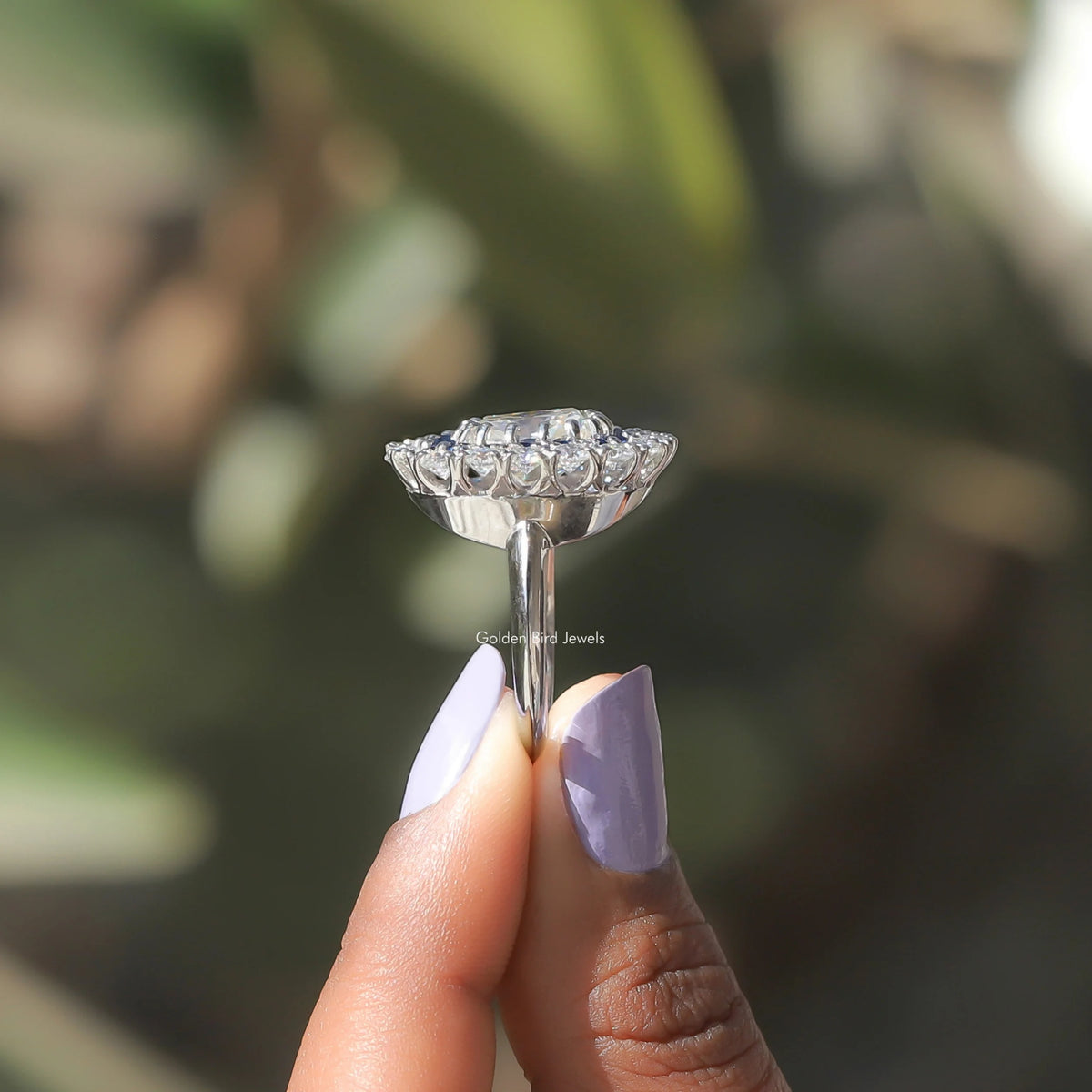 Side View of Old Mine Cushion Cut Moissanite Ring In two fingers