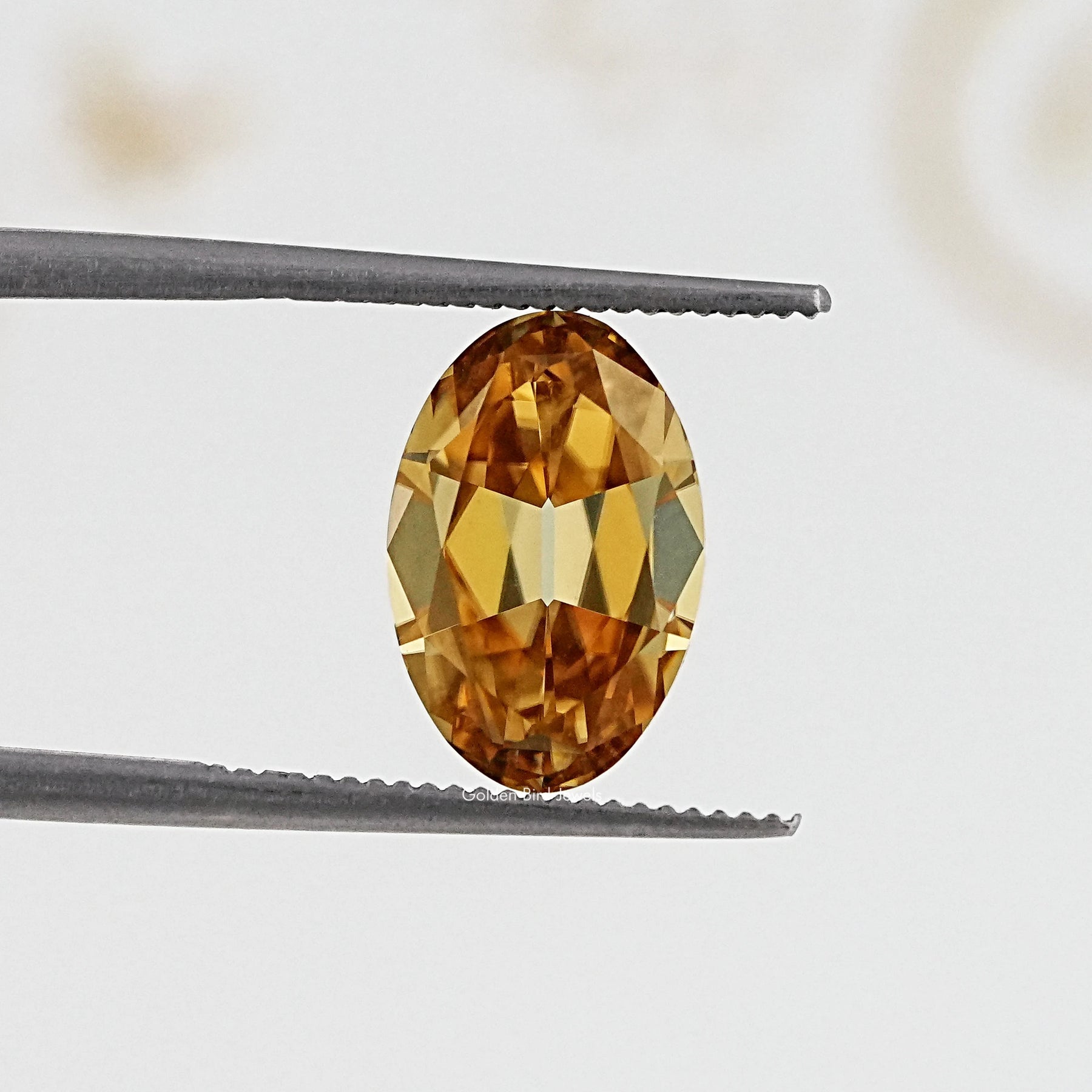 In Tweezer View Of Old Mine Oval Cut Loose Moissanite Stone