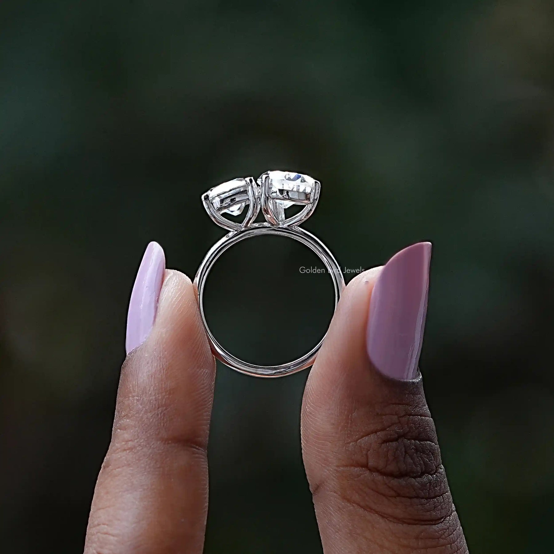 Back View of Old Mine Pear Cut Moissanite Ring In two fingers