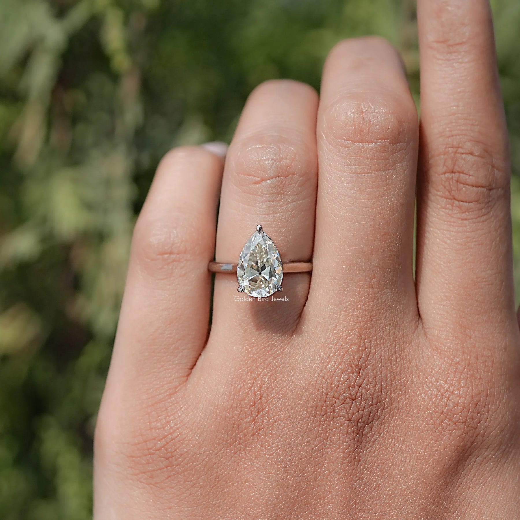 In finger front view of Halo Moissanite Engagement Ring