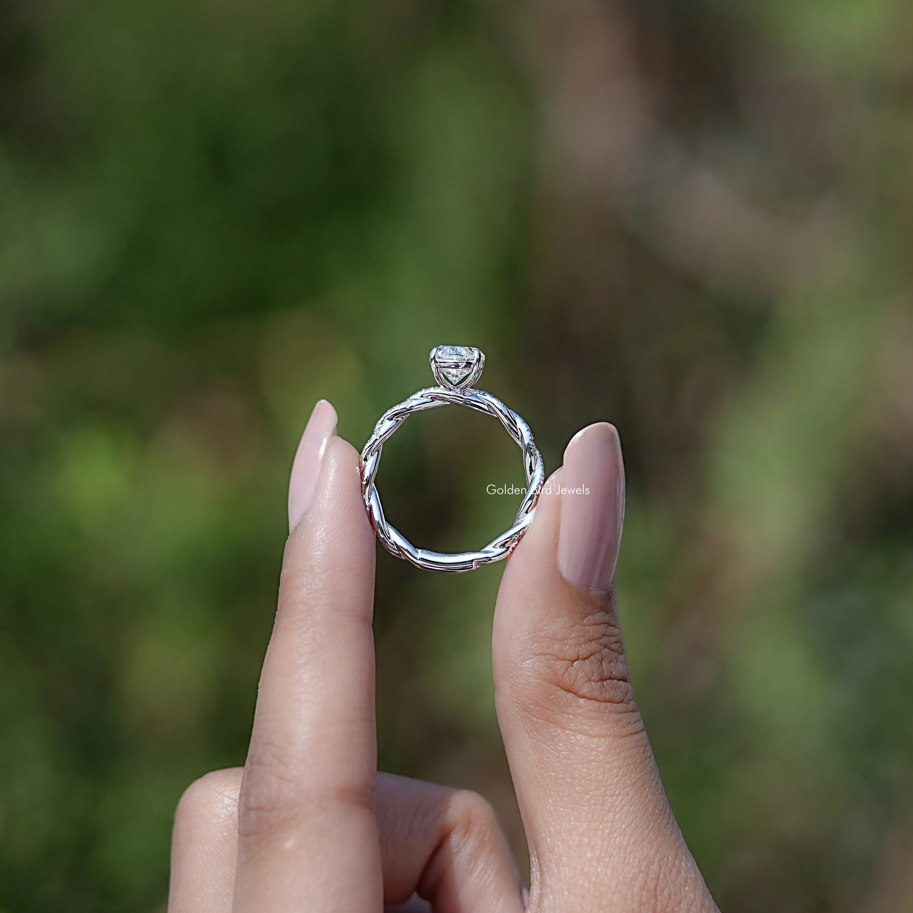 Back view of Oval Shaped Moissanite Twisted Shank Accent Ring in secure setting