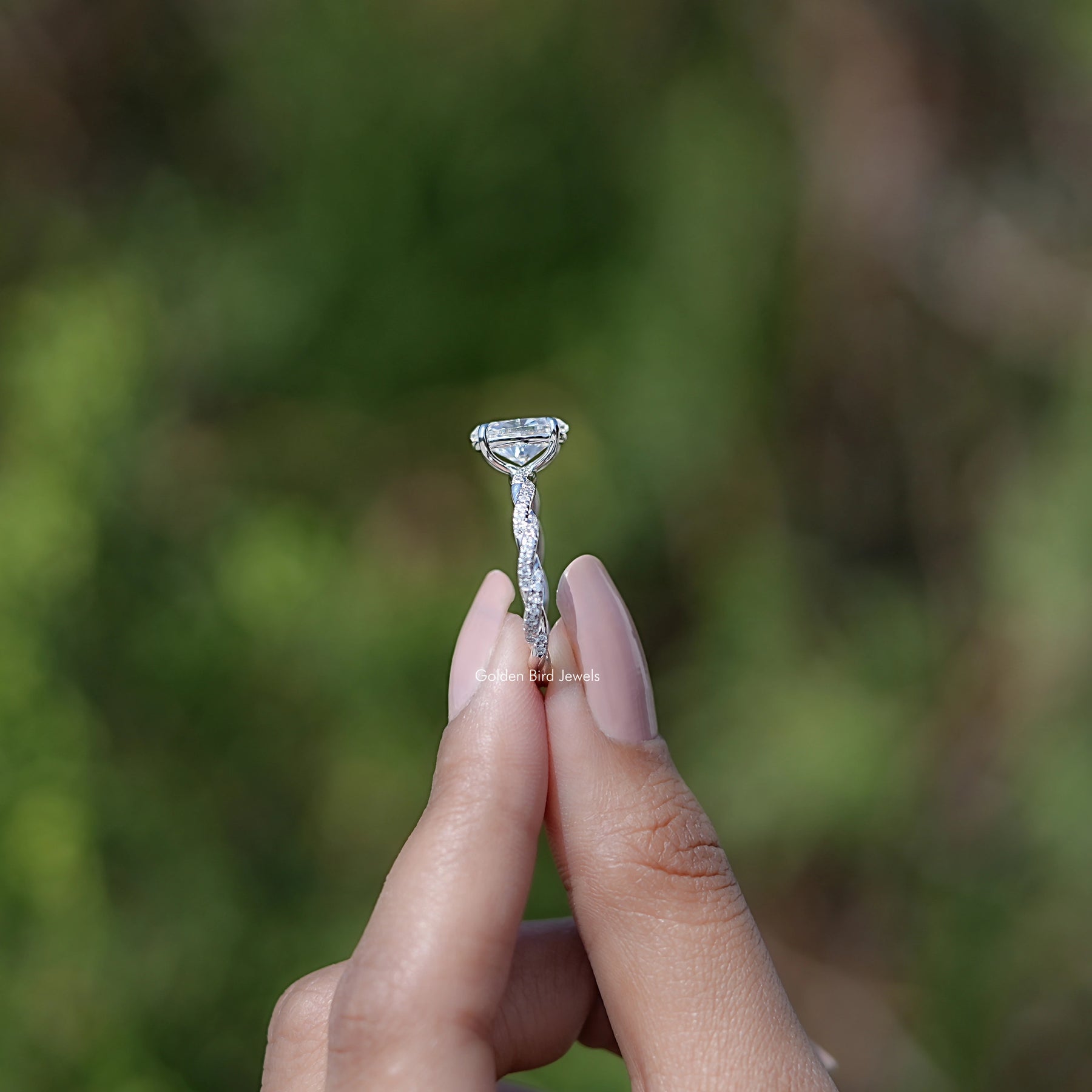 Side View of Oval Shaped Moissanite Twisted Shank Accent Ring