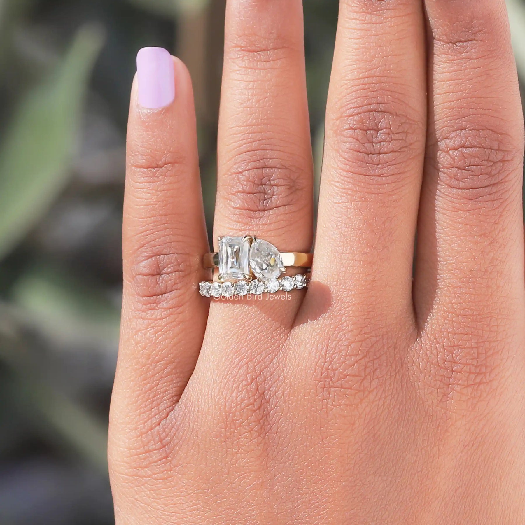 View of Pear and Criss Cut toi et moi Moissanite Ring with matching wedding band