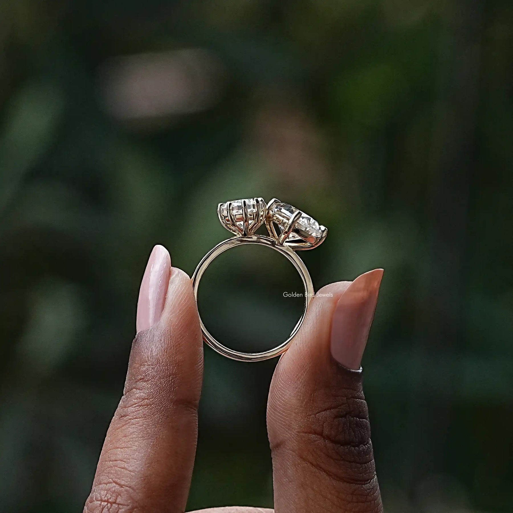 Back View of Dutch Marquise Cut Moissanite Toi Et Moi Ring In two fingers