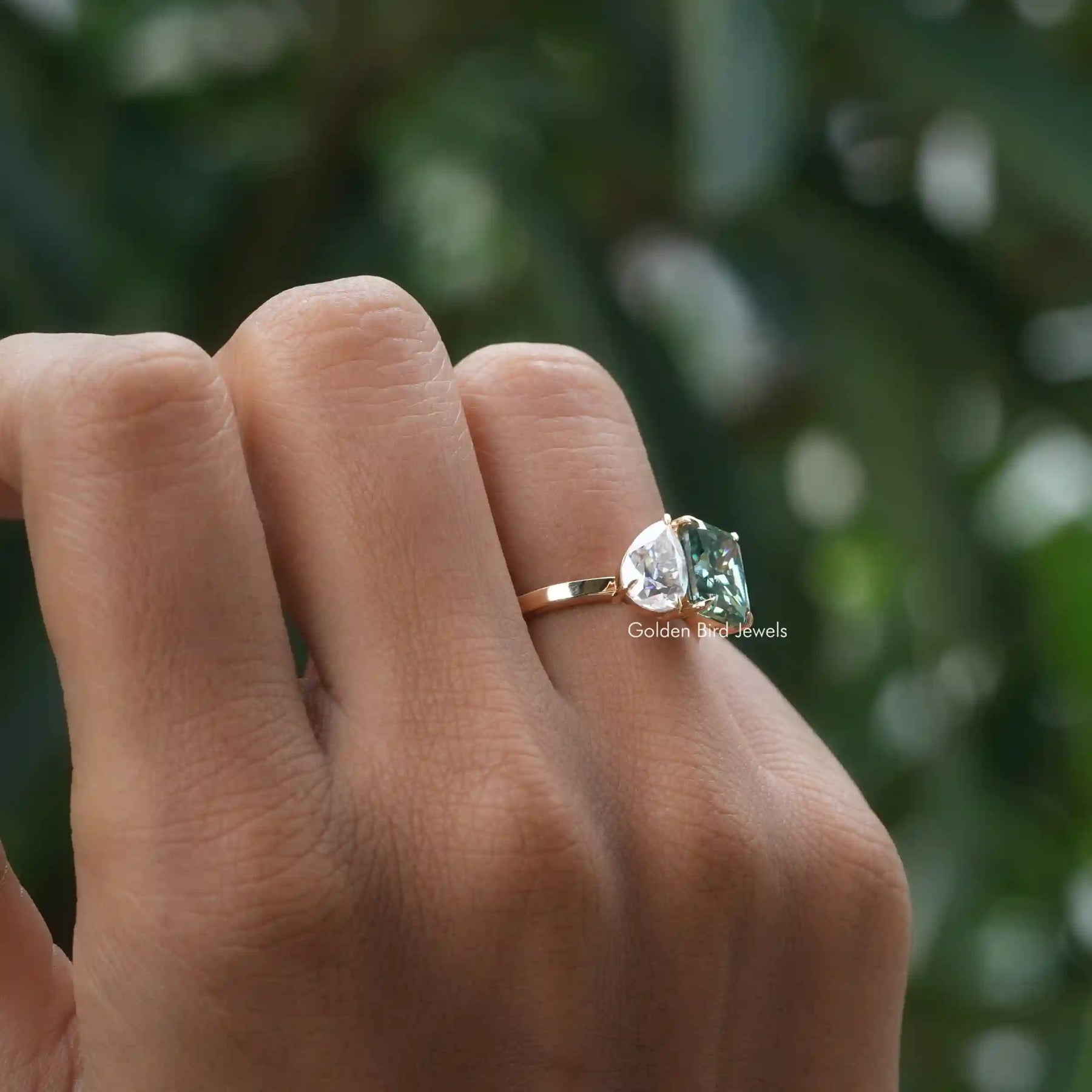 View of Pear And Radiant Cut Moissanite Ring In Yellow Gold