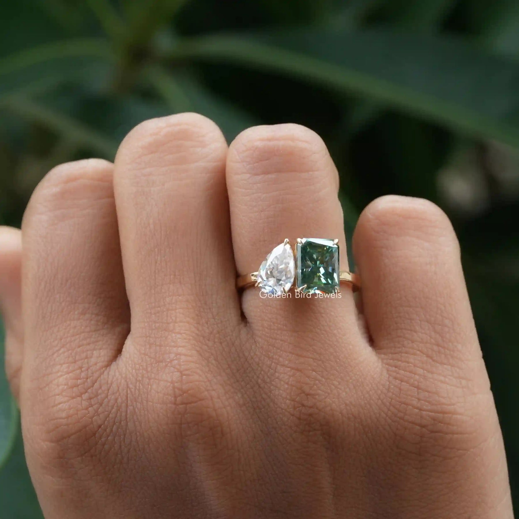 View of Pear And Radiant Moissanite Toi Et Moi Ring In Yellow Gold