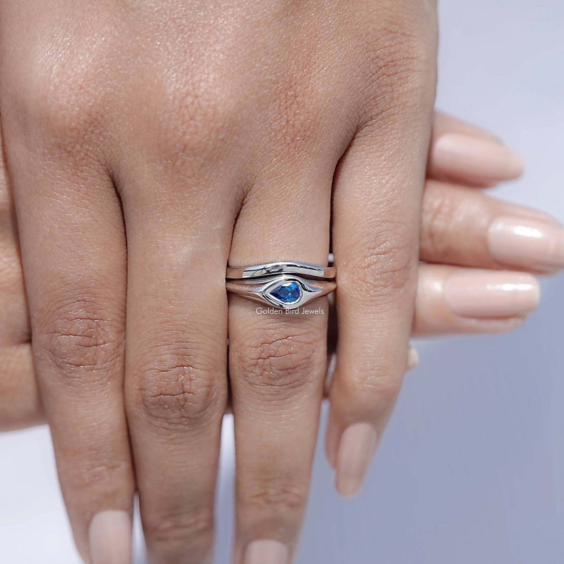 View of Pear Shaped Solitaire Moissanite Ring in prongs setting