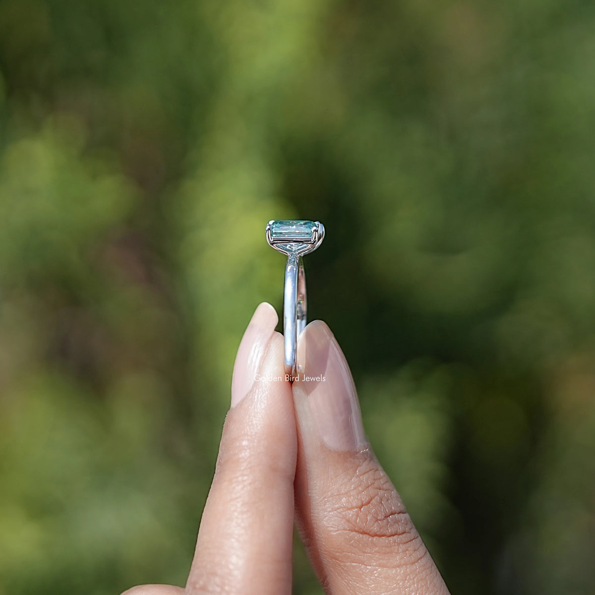 Side View of Pear And Emerald Cut Two Stone Moissanite Ring