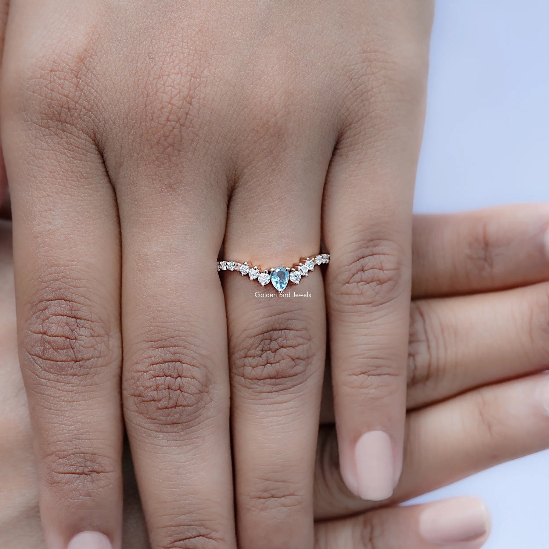 Close view of Pear and Round Cut Moissanite Solitaire Ring