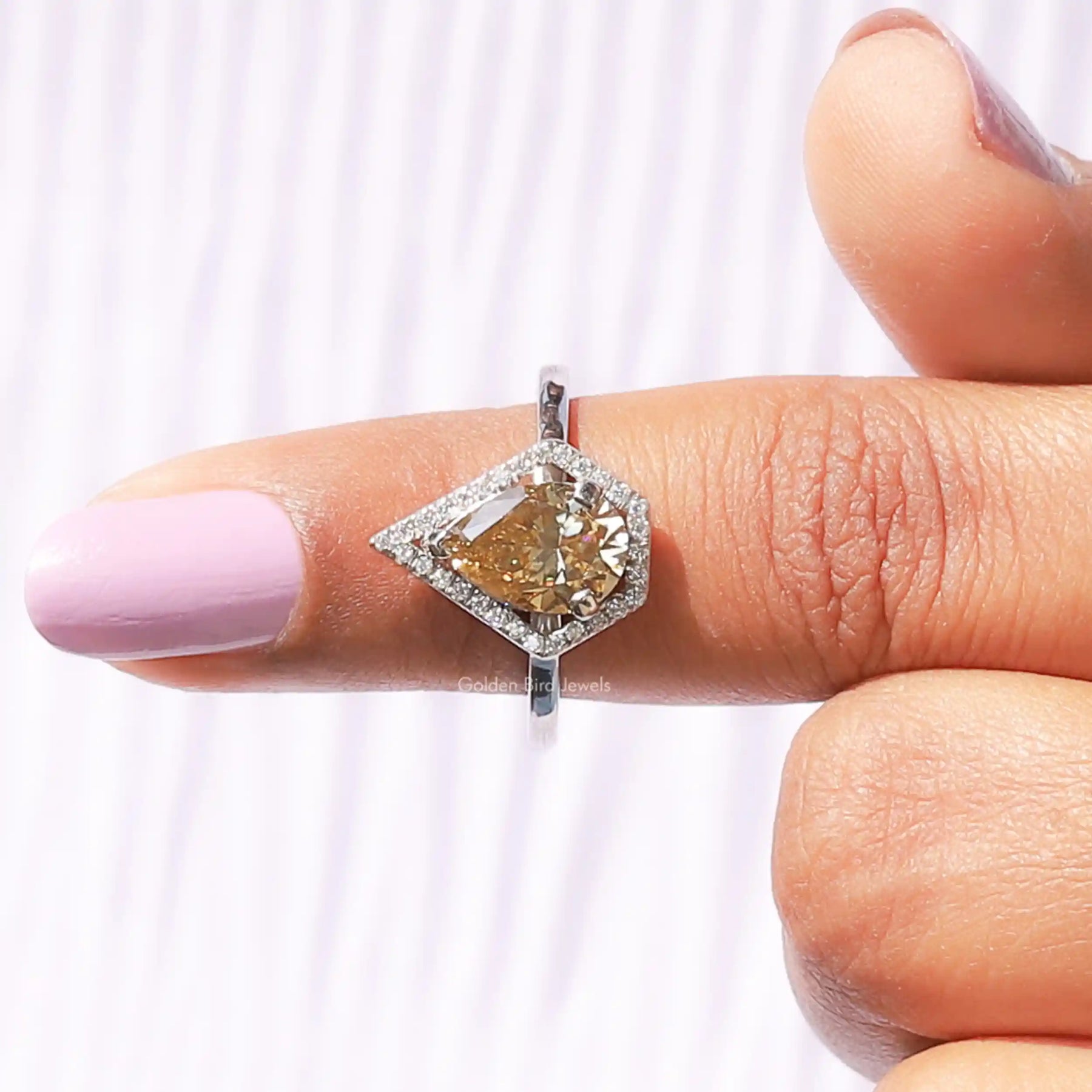 In finger front View of Pear Moissanite Cut Engagement Ring In White Gold