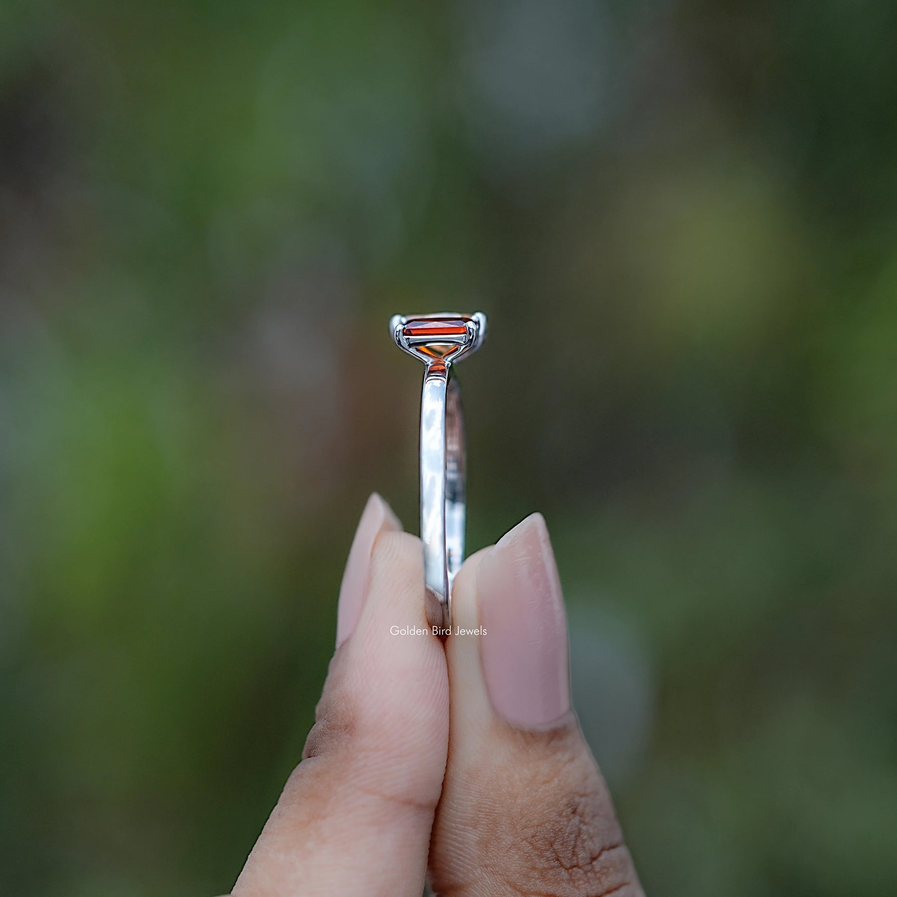Side view of Radiant And Pear Gemstone Toi Et Moi Ring