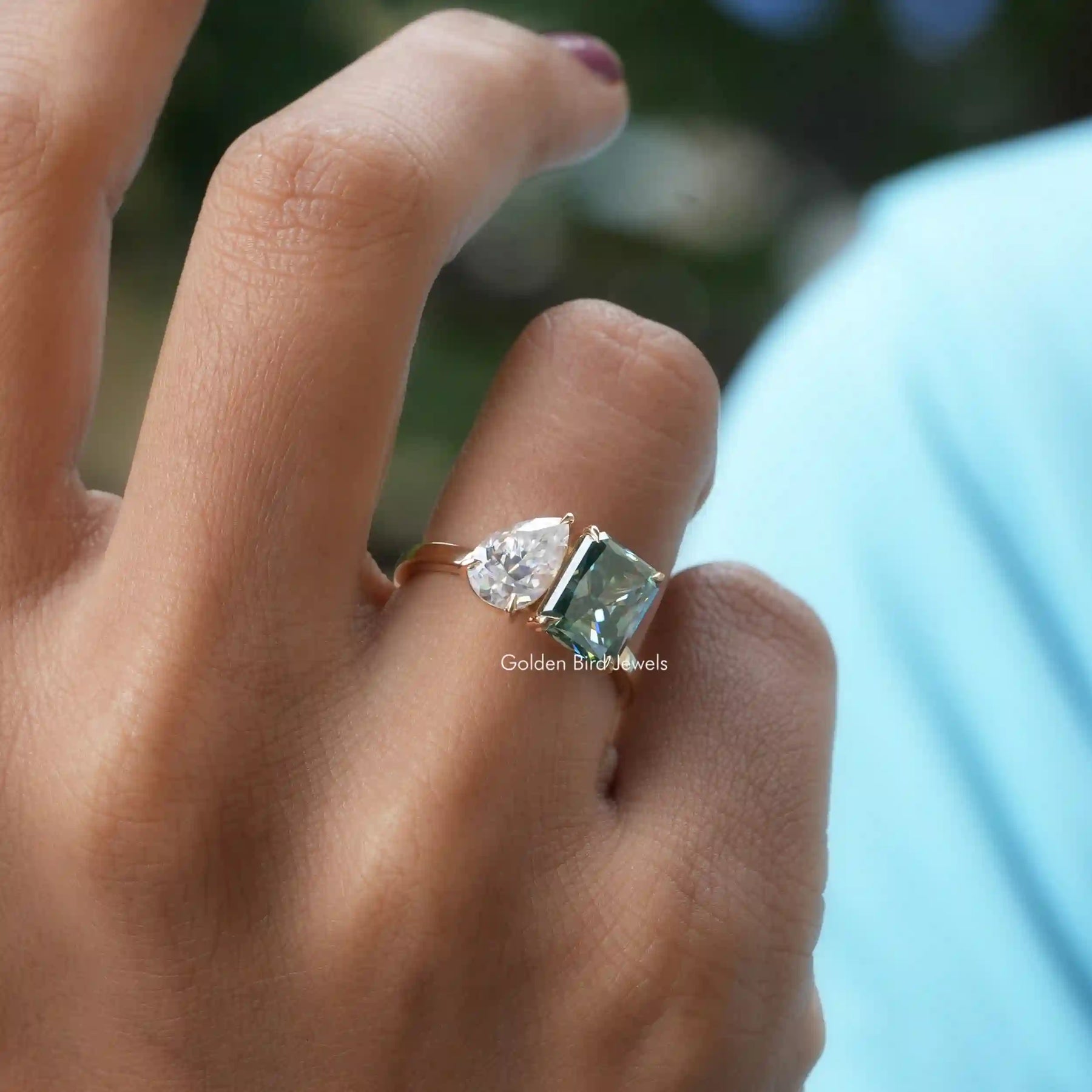 View of Radiant Cut Moissanite Toi Et Moi Ring In Finger