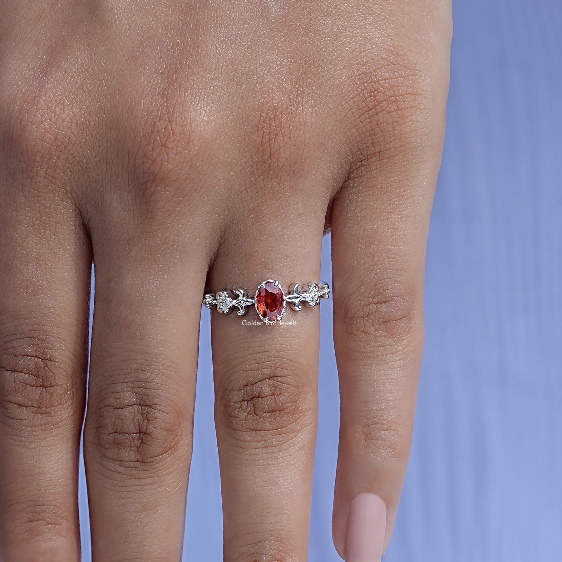 Red Ruby Oval Cut Accent Engagement Ring In finger