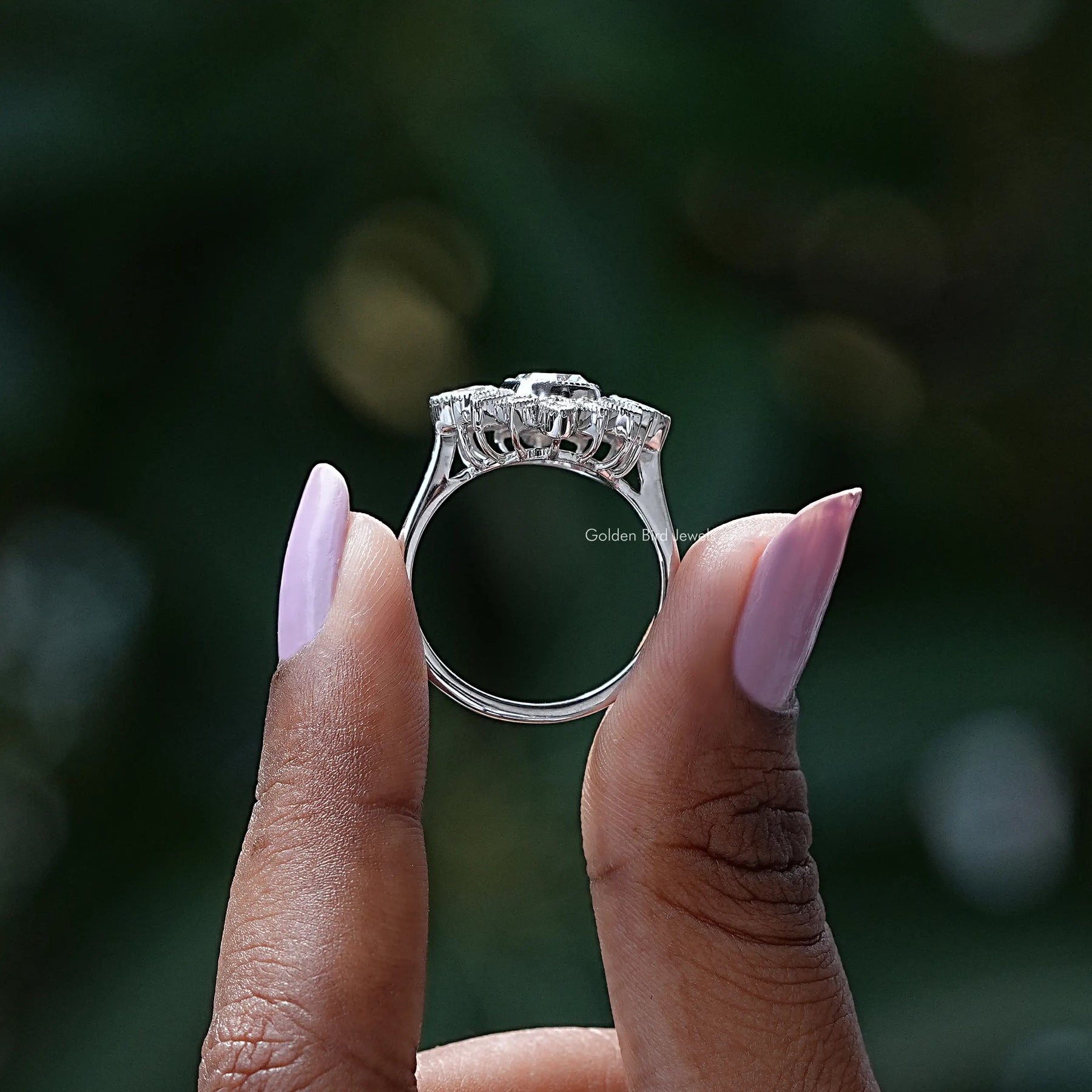 Back View of Moissanite Cushion Cut Halo Cluster Ring In two fingers