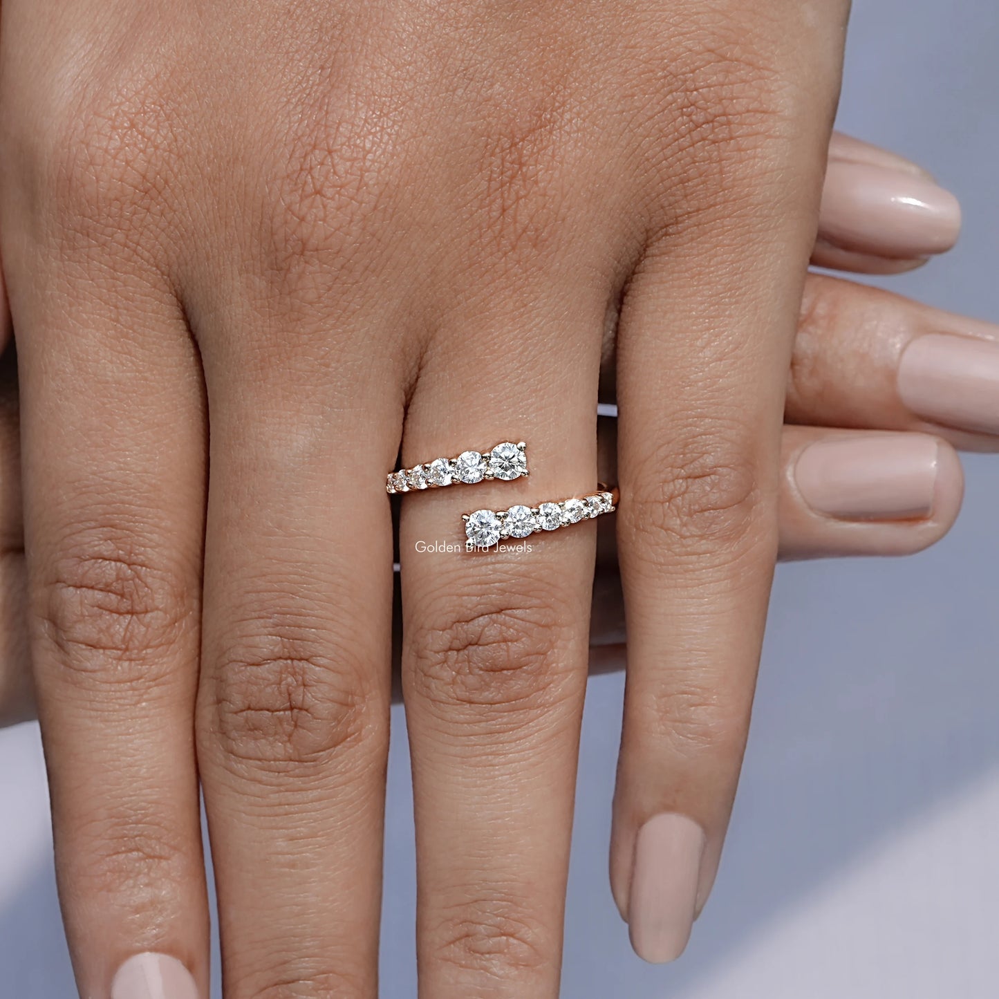 In finger front view of Open Wrap Moissanite Engagement Ring in unique shape
