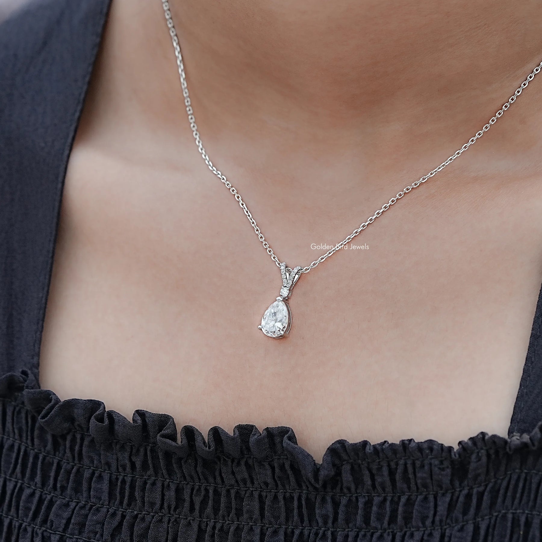 Detailed View Of Round And Pear Cut solitaire pendant