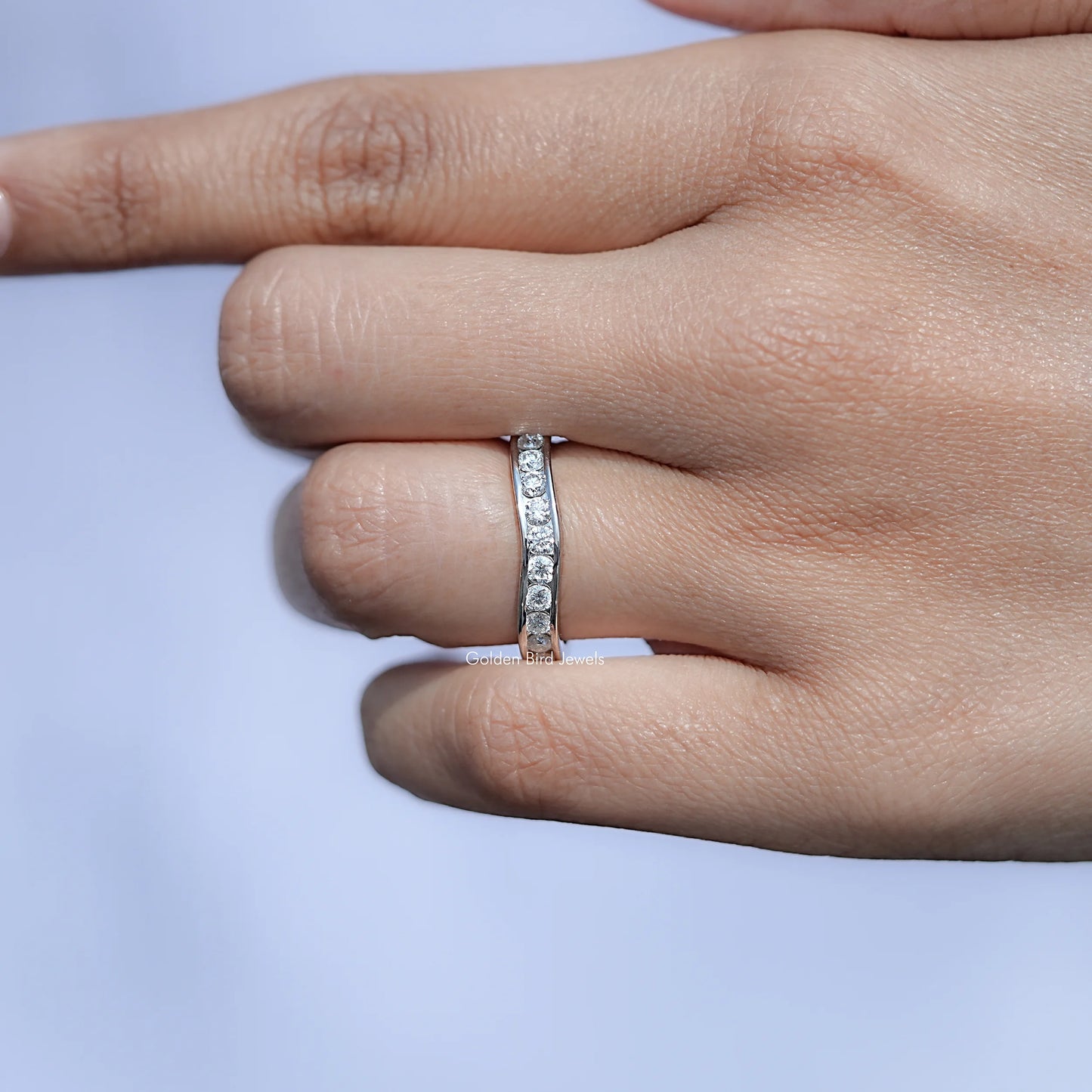 In front finger View Of Round Cut Moissanite solitaire Ring