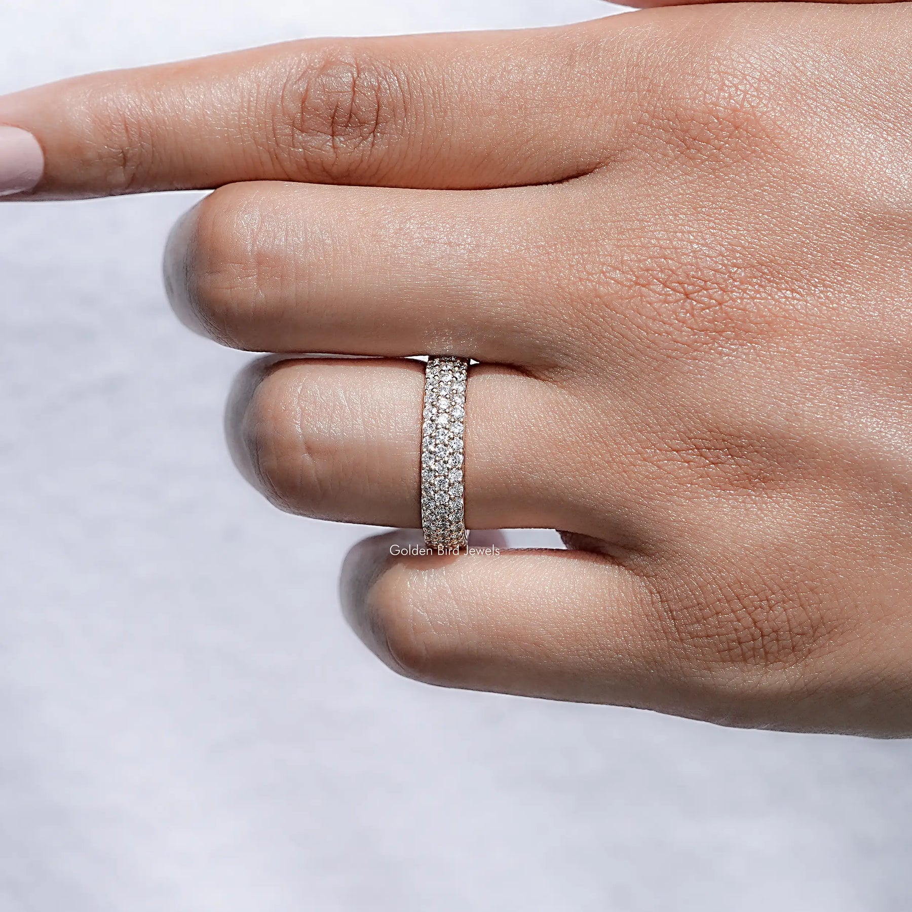 Detailed view of Round Cut Diamond Three Row Band