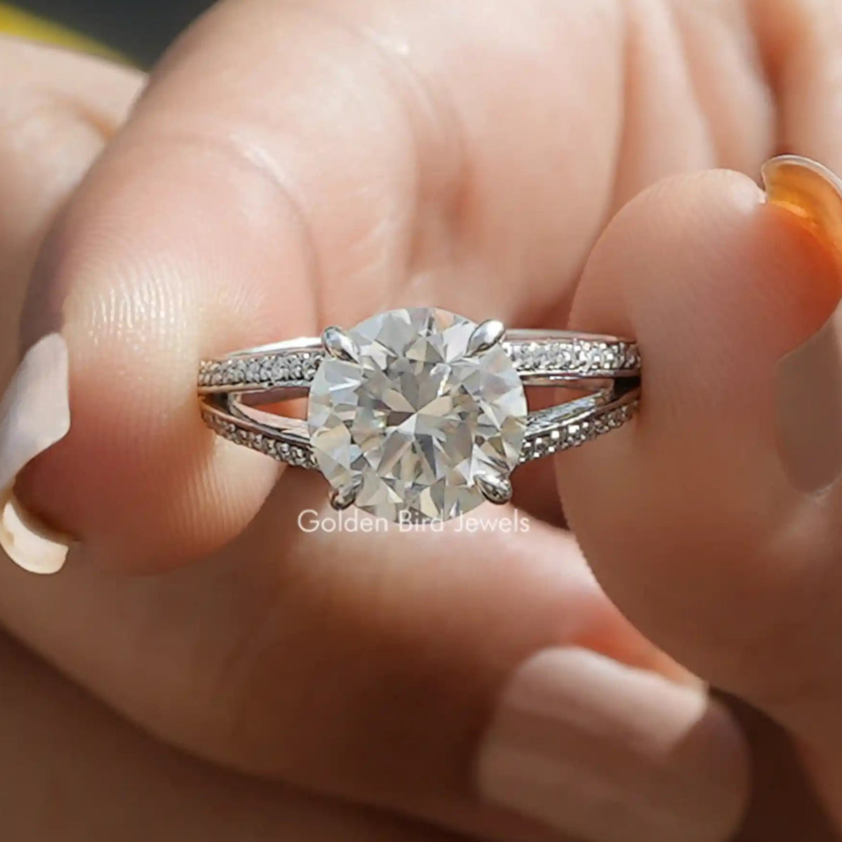 Front View of Round cut moissanite accent stone engagement ring In Two Fingers