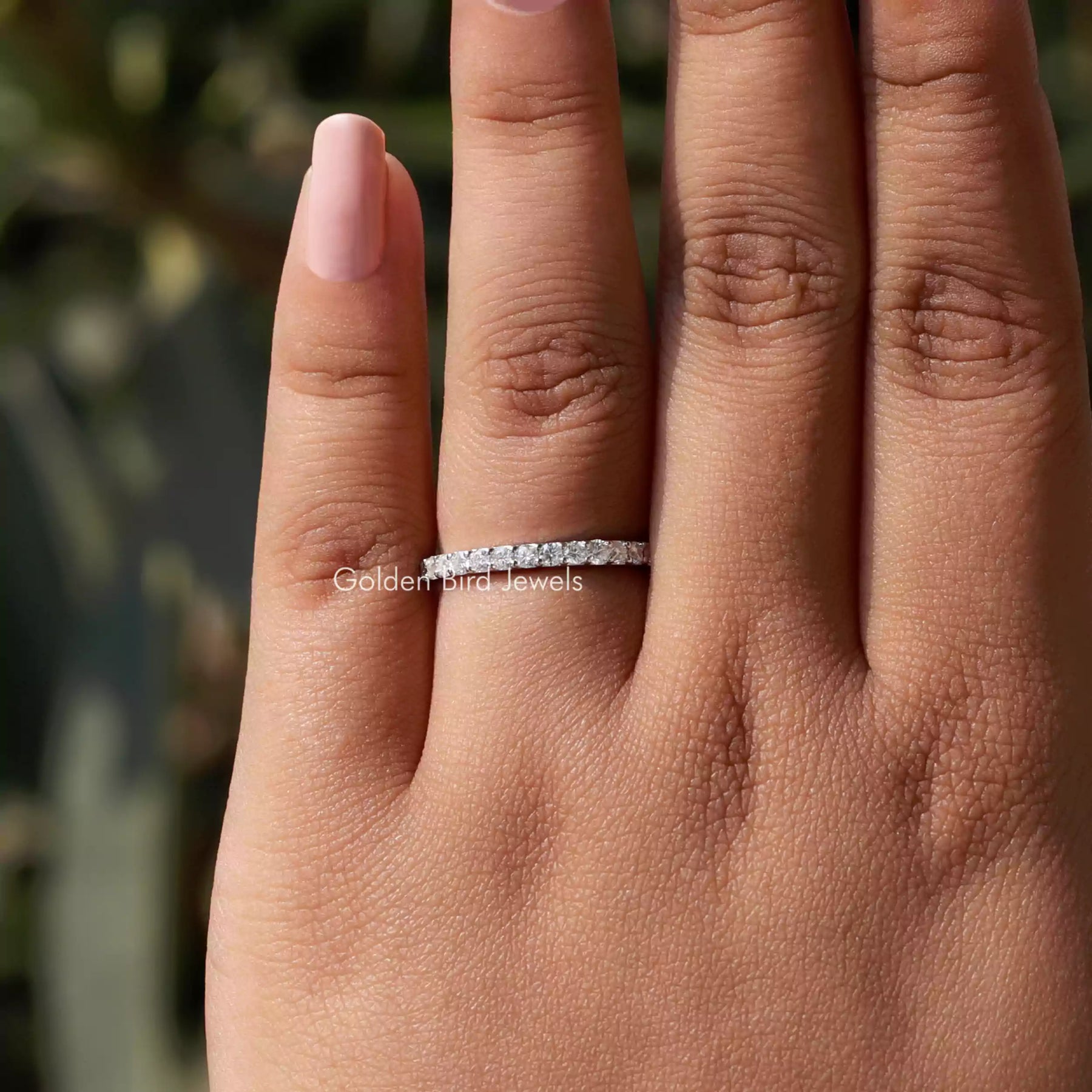 In finger view of Round Cut Moissanite Solitaire Ring
