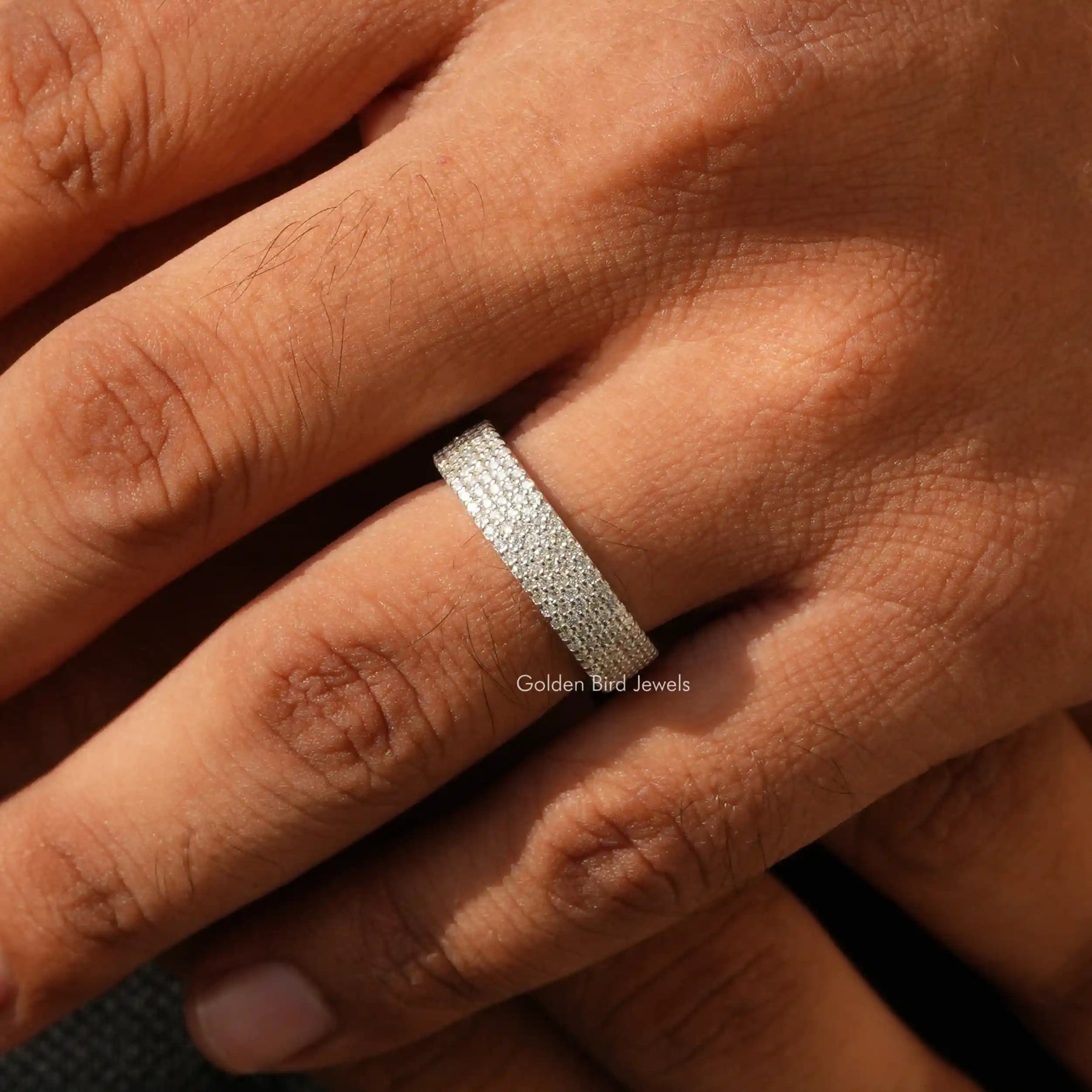 Close view of moissanite ring in a secure setting