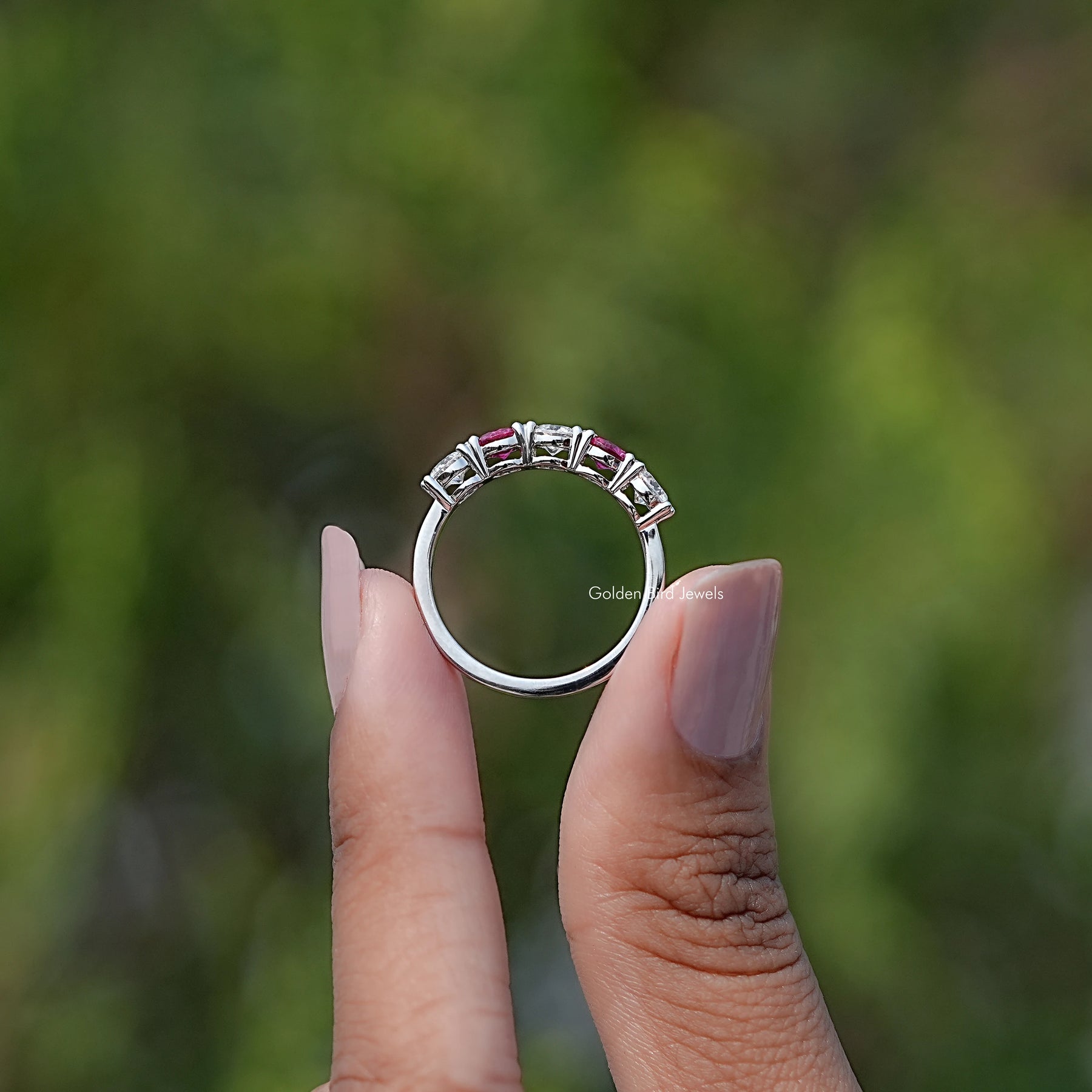 In finger view of Round Gemstone Wedding Band
