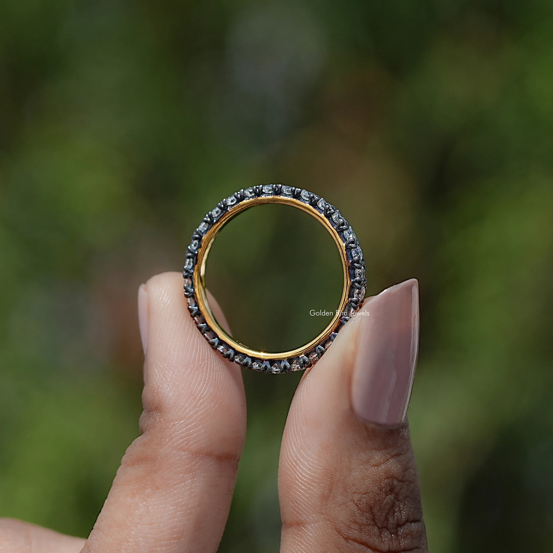 Back view of Round Cut Moissanite Solitaire Ring in secure setting