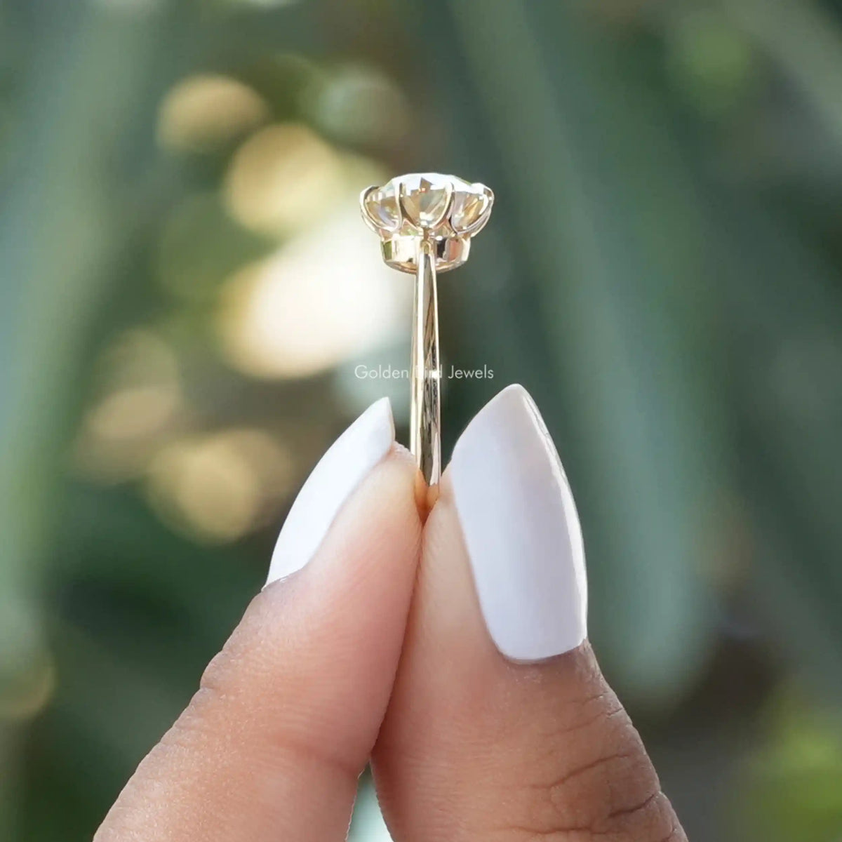 Side View of Round Solitaire Moissanite Engagement Ring In finger