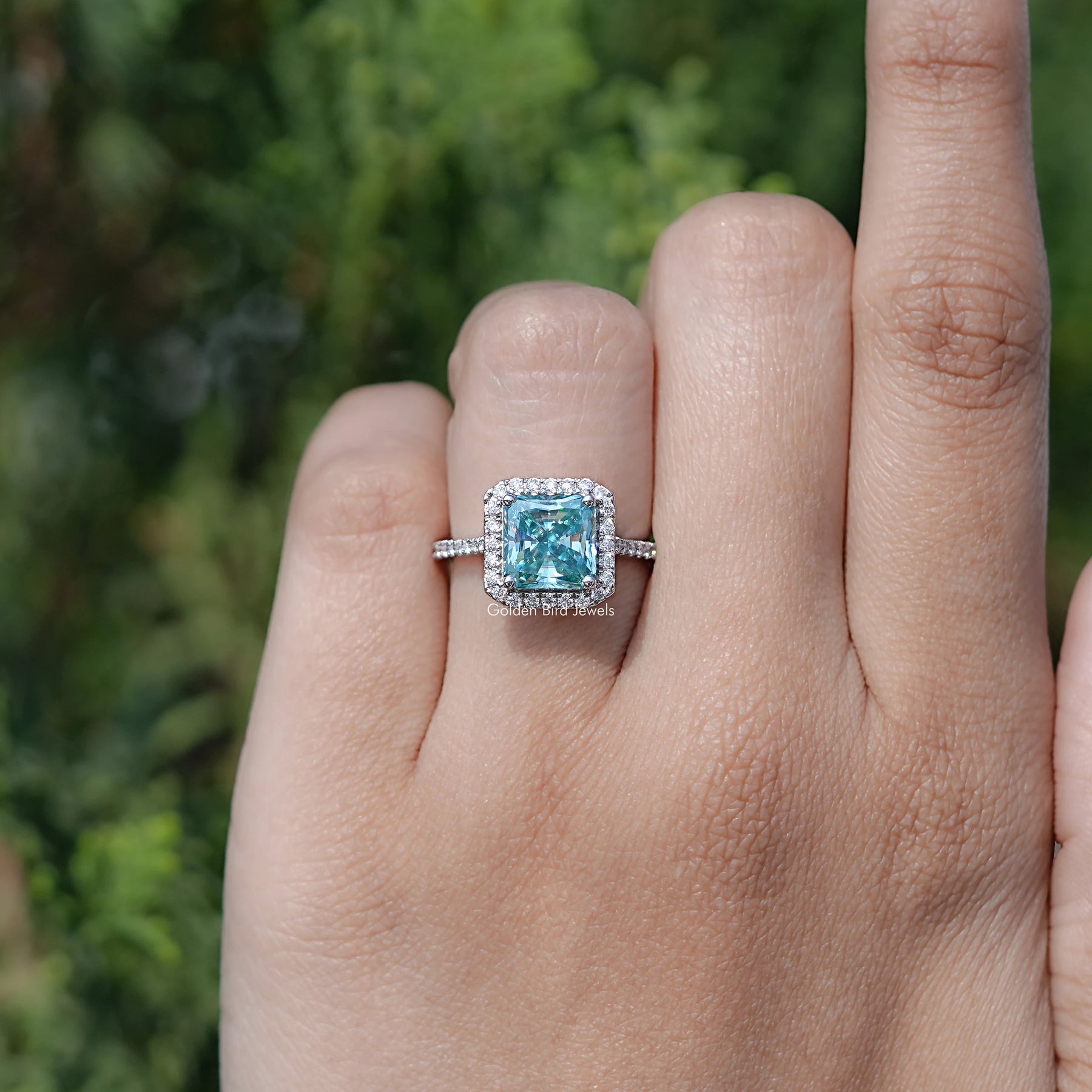 In finger view of Round Cut Solitaire Engagement Ring