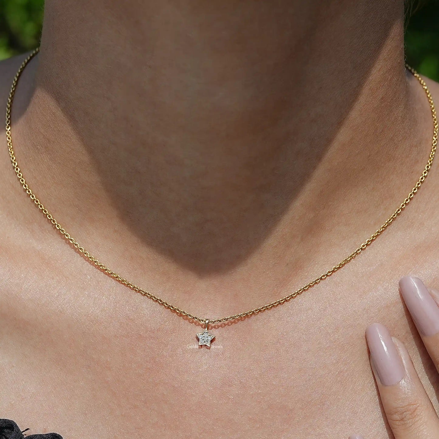 View of Star Shaped Round Cut Diamond Pendant In Yellow Gold